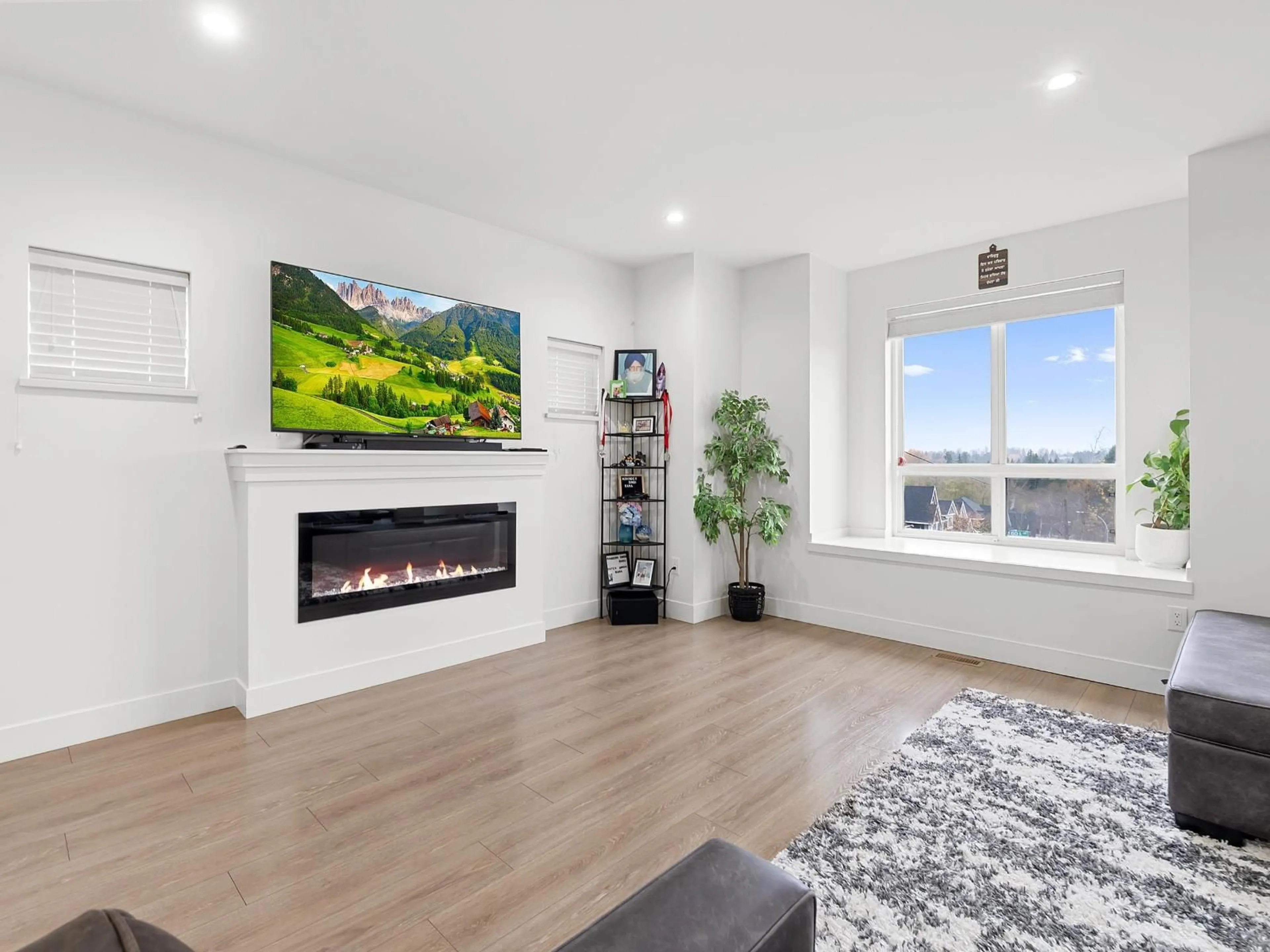 Living room with furniture, wood/laminate floor for 14002 60A AVENUE, Surrey British Columbia V3X0J9