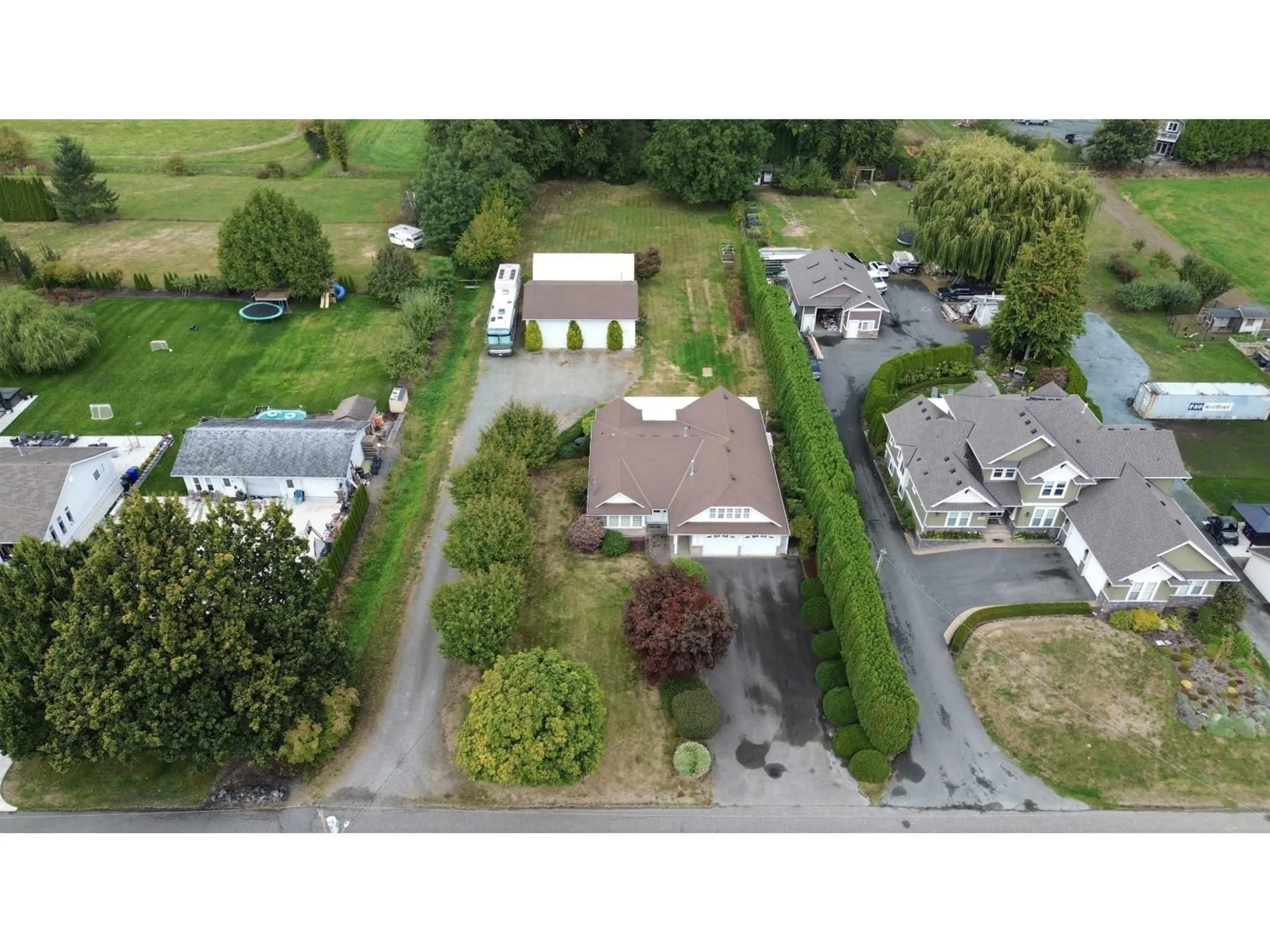 A pic from outside/outdoor area/front of a property/back of a property/a pic from drone, street for 42703 JANZEN ROAD, Sardis - Greendale British Columbia V2R4K4