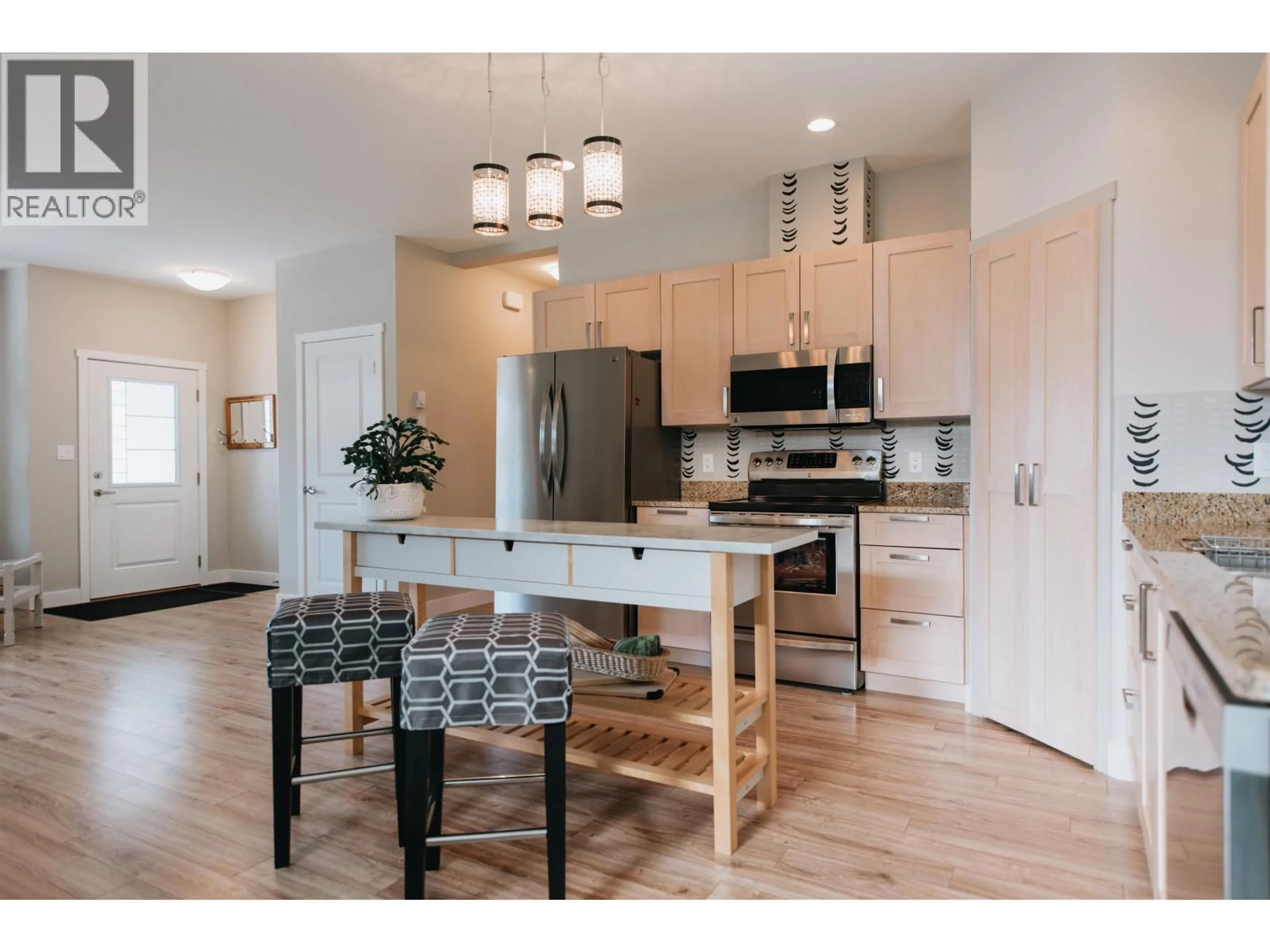 Open concept kitchen, wood/laminate floor for 6222 SITKA ROAD, Sechelt British Columbia V7Z0L3