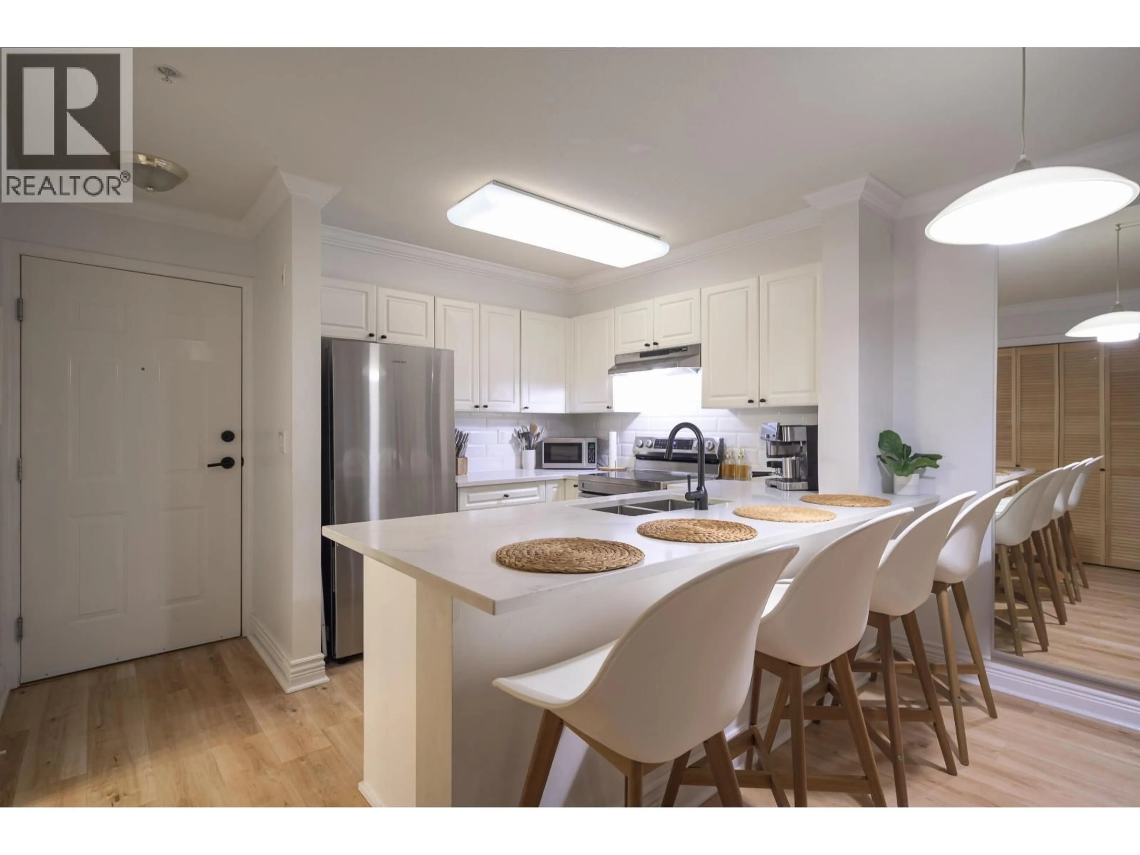 Open concept kitchen, wood/laminate floor for 205 - 1363 56 STREET, Delta British Columbia V4L2P7