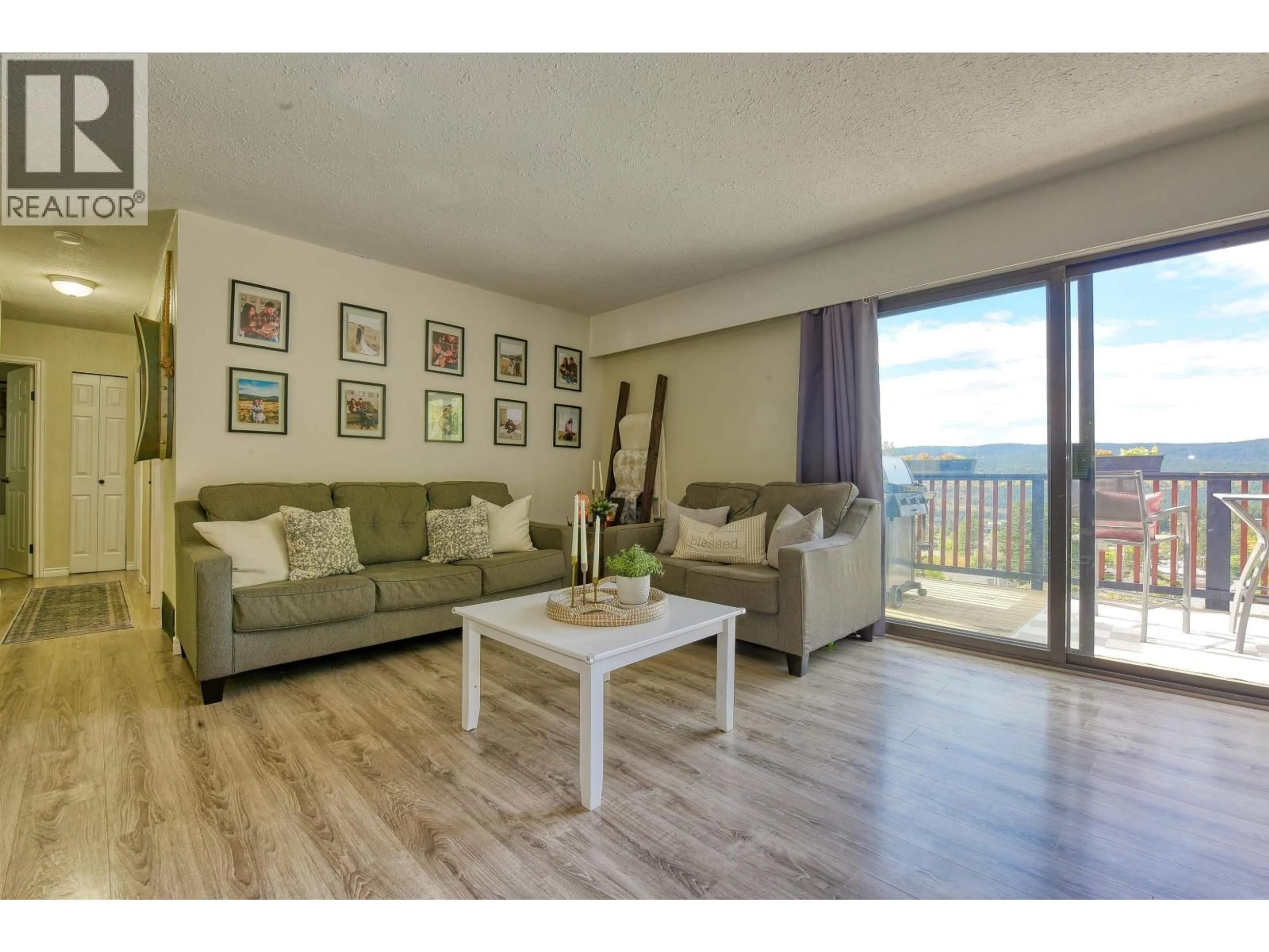 Living room with furniture, wood/laminate floor for 657 CENTENNIAL DRIVE, Williams Lake British Columbia V2G4E5