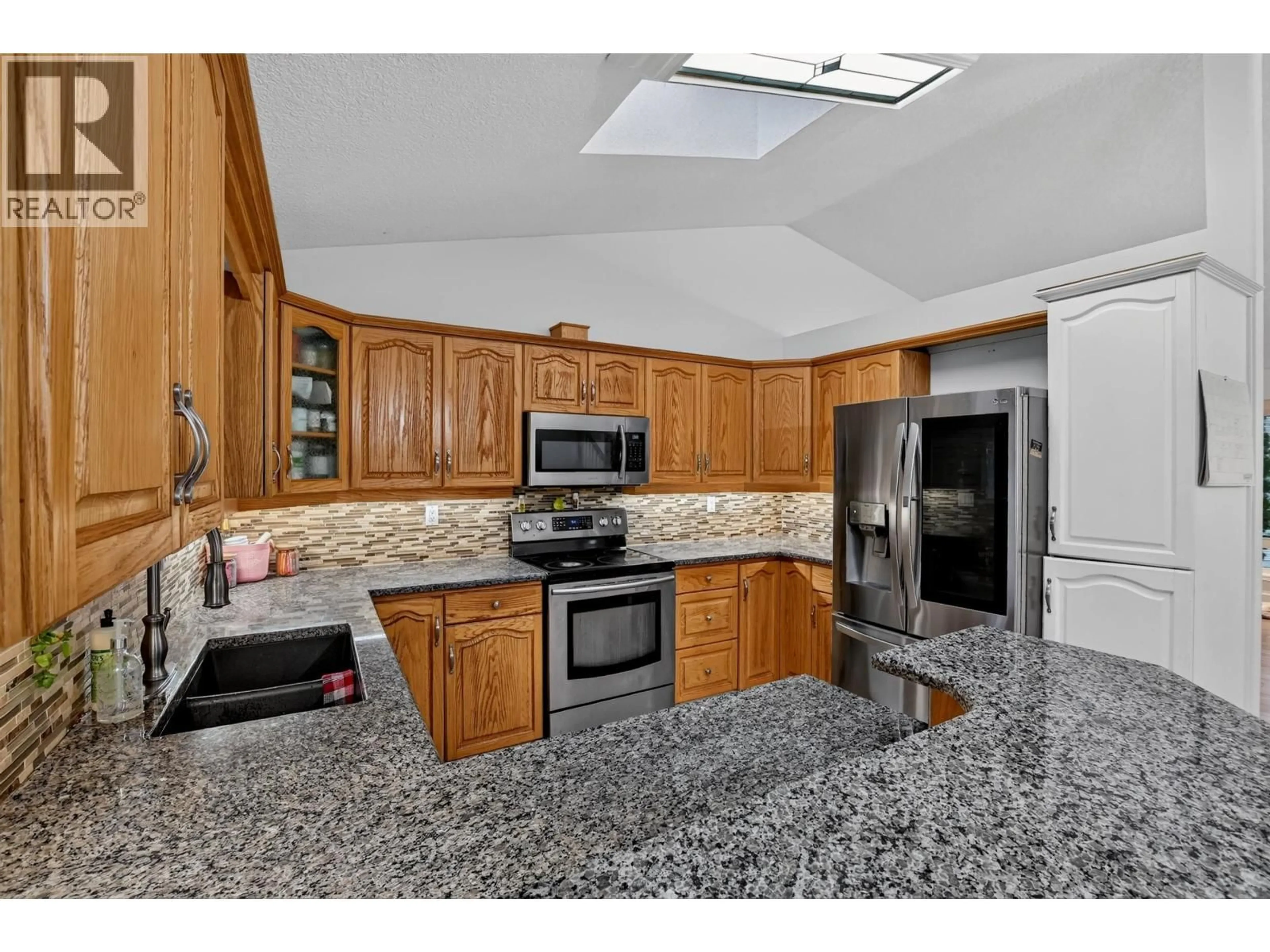 Open concept kitchen, ceramic/tile floor for 6320 BLISS POINT, Prince George British Columbia V2K5A7