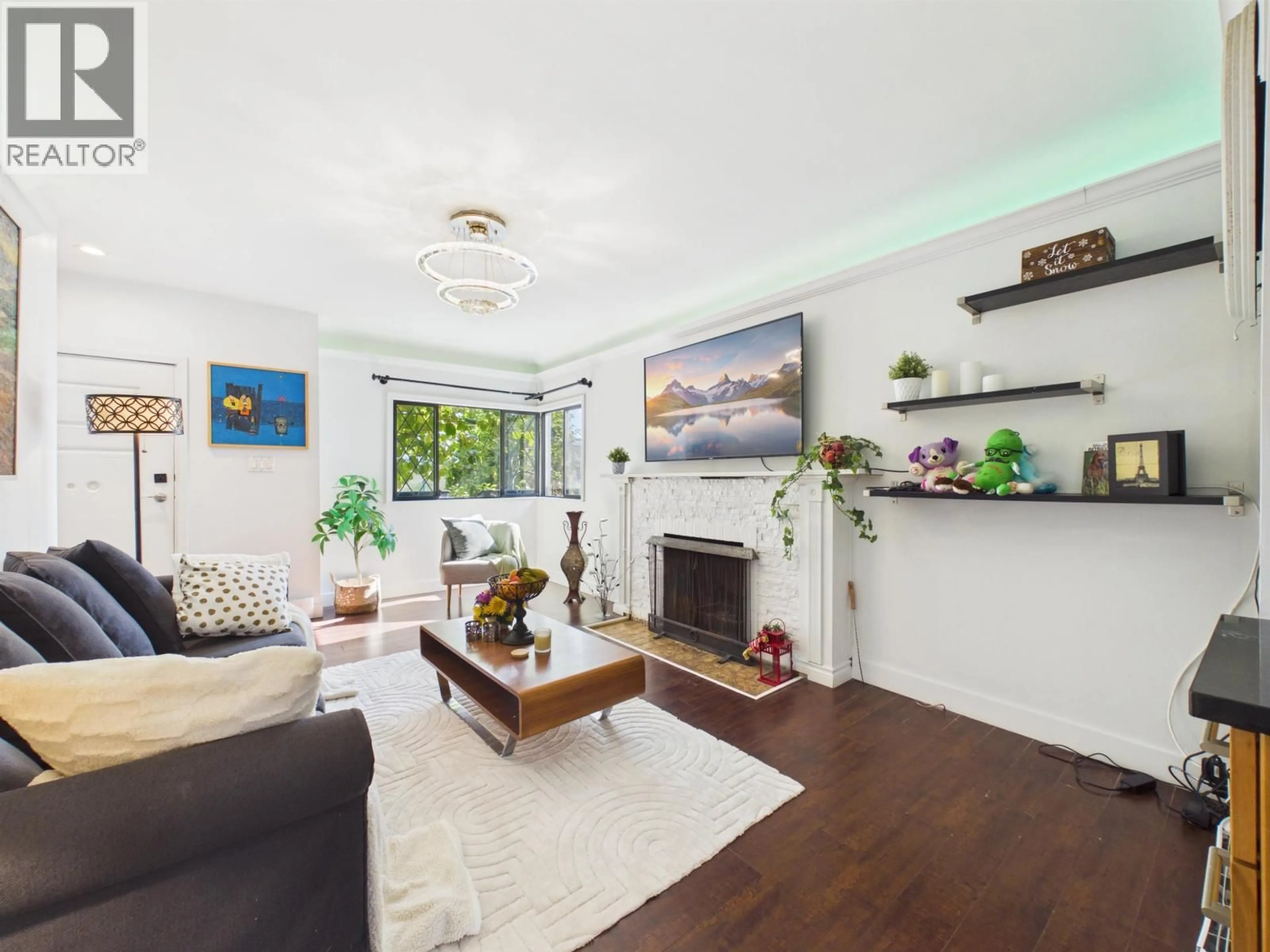 Living room with furniture, wood/laminate floor for 4605 RUPERT STREET, Vancouver British Columbia V5R2J4