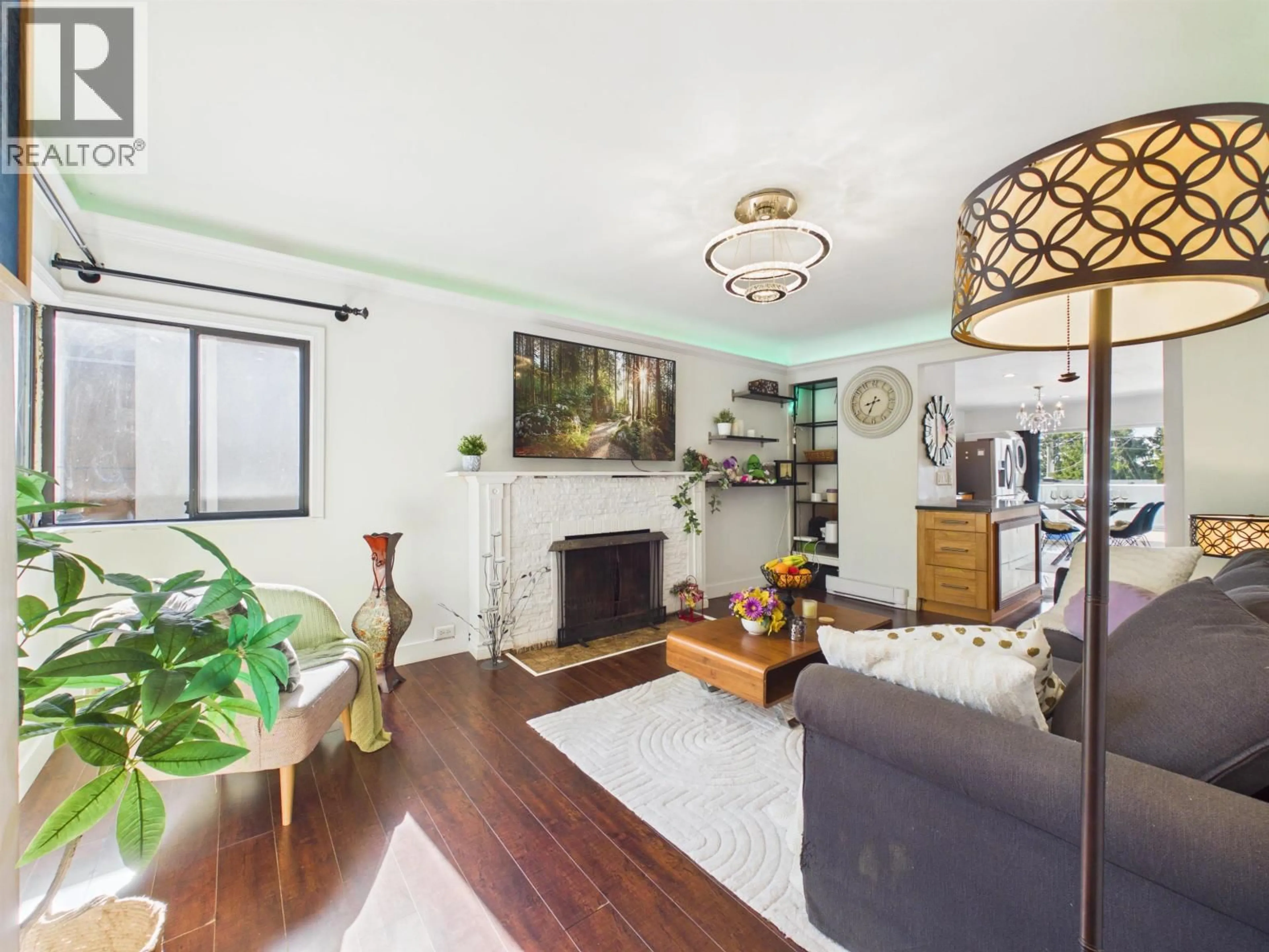Living room with furniture, wood/laminate floor for 4605 RUPERT STREET, Vancouver British Columbia V5R2J4