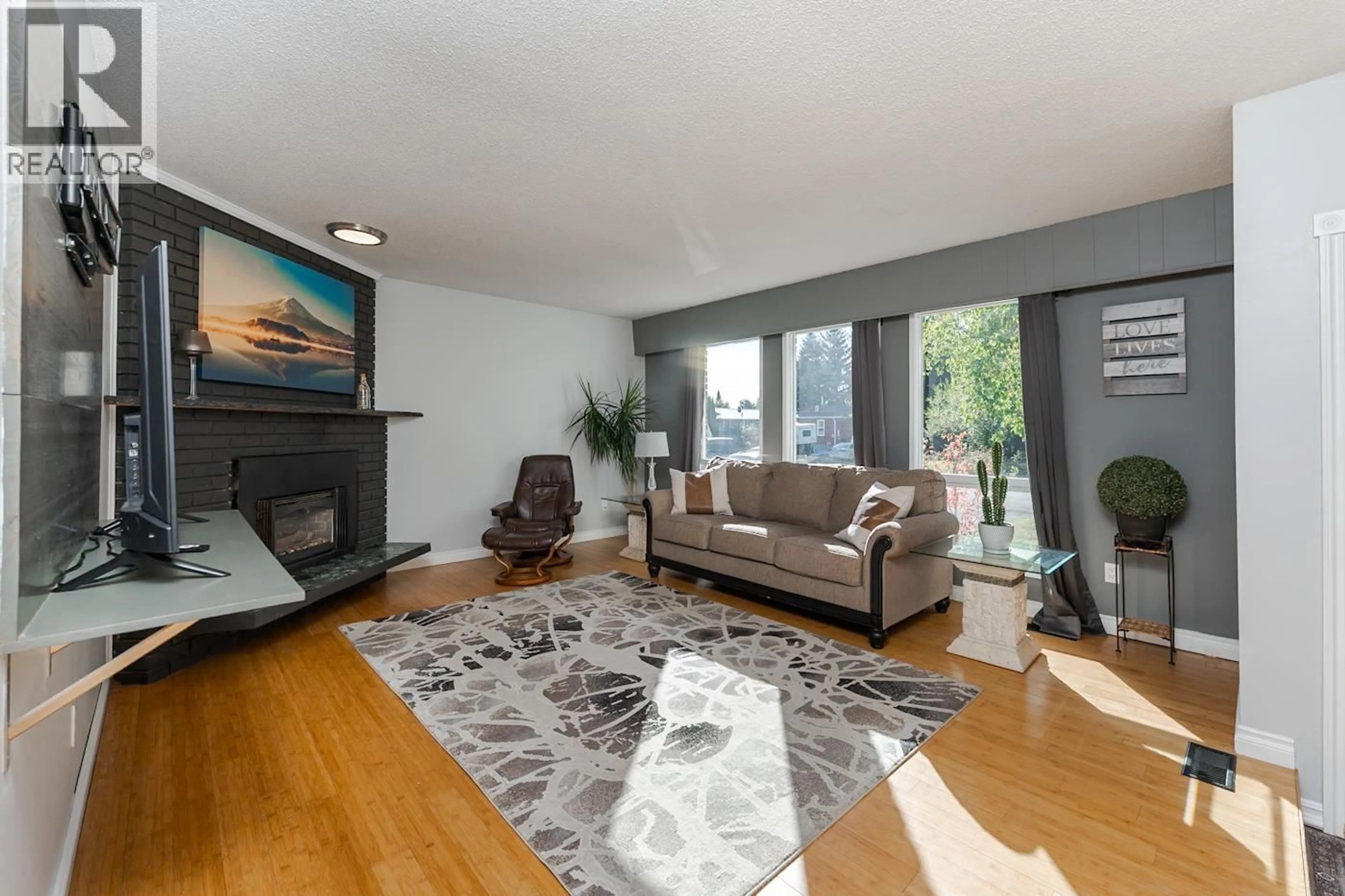 Living room with furniture, wood/laminate floor for 8068 PRINCETON CRESCENT, Prince George British Columbia V2N3W5