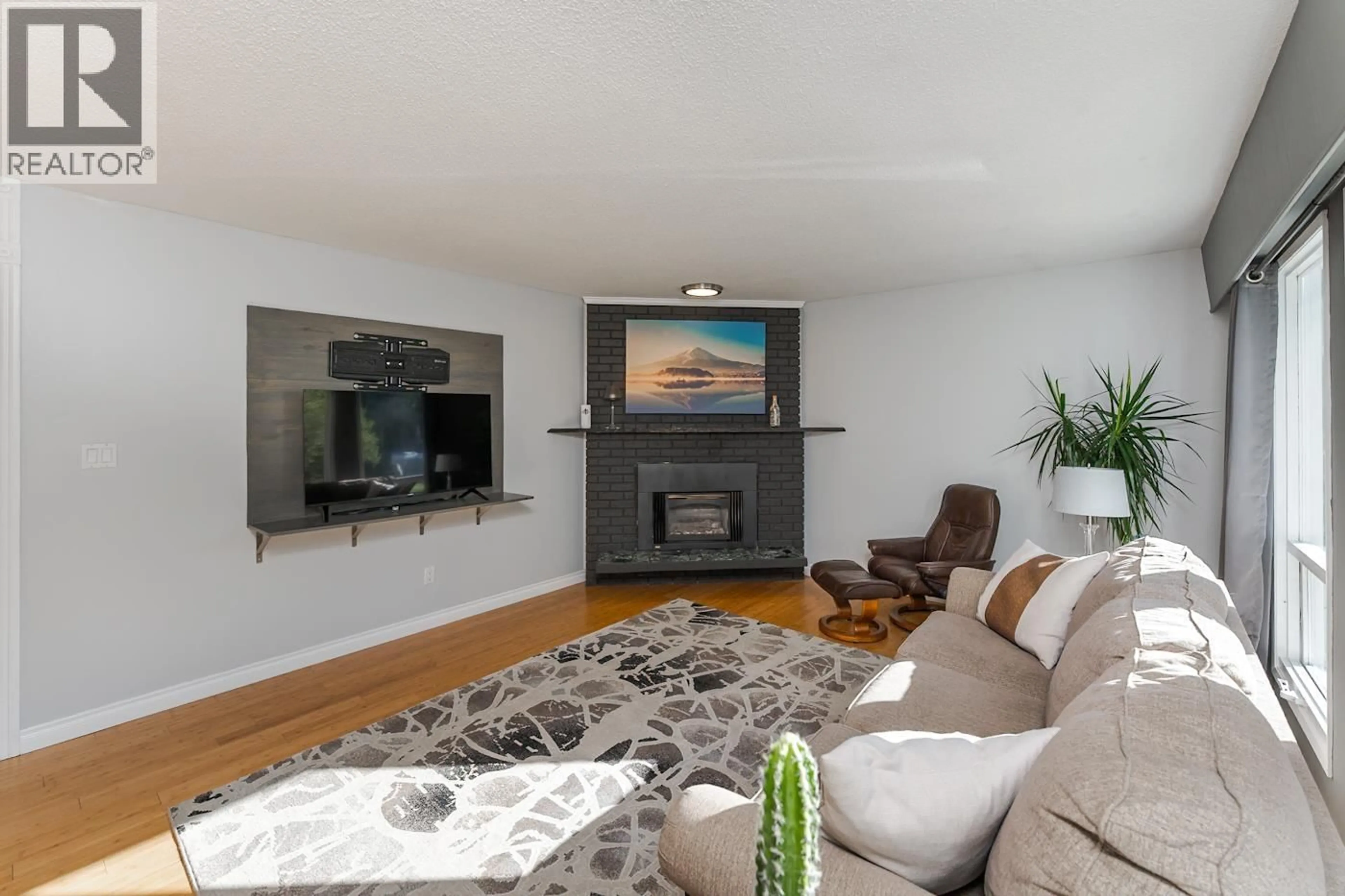 Living room with furniture, wood/laminate floor for 8068 PRINCETON CRESCENT, Prince George British Columbia V2N3W5