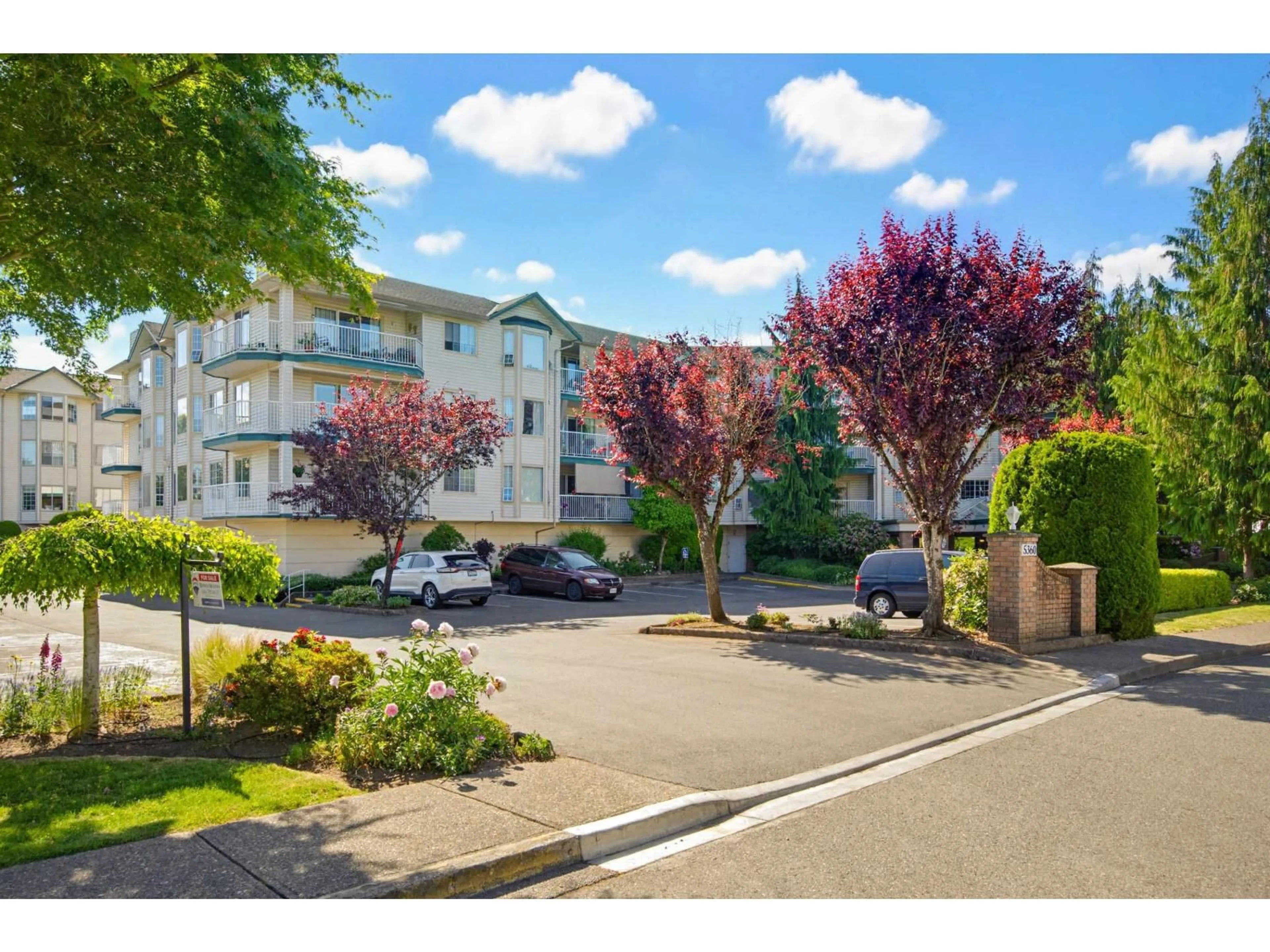 A pic from outside/outdoor area/front of a property/back of a property/a pic from drone, street for 205 - 5360 205 STREET, Langley British Columbia V3A7Y6