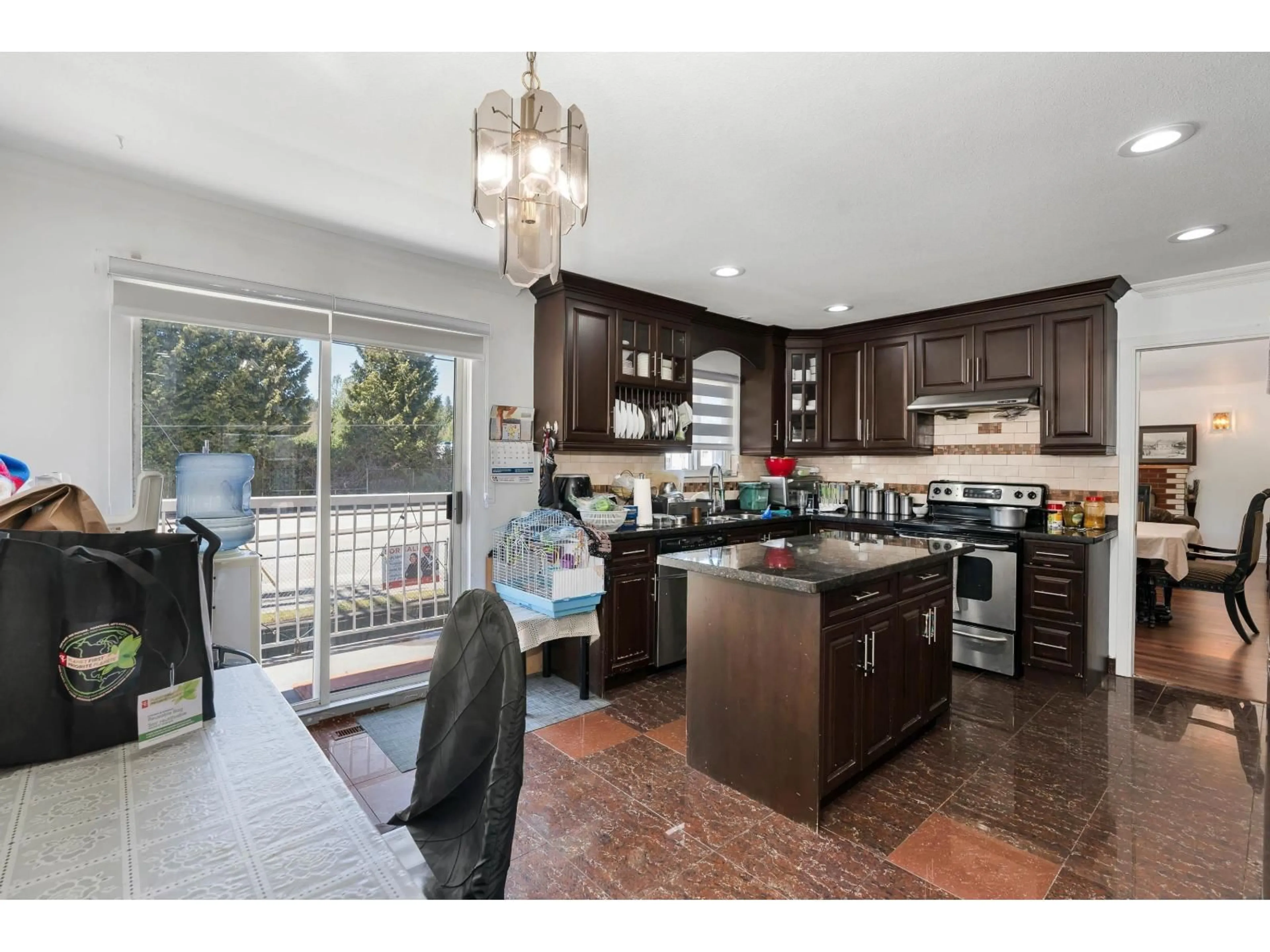 Open concept kitchen, ceramic/tile floor for 8724 128 STREET, Surrey British Columbia V3W4G6