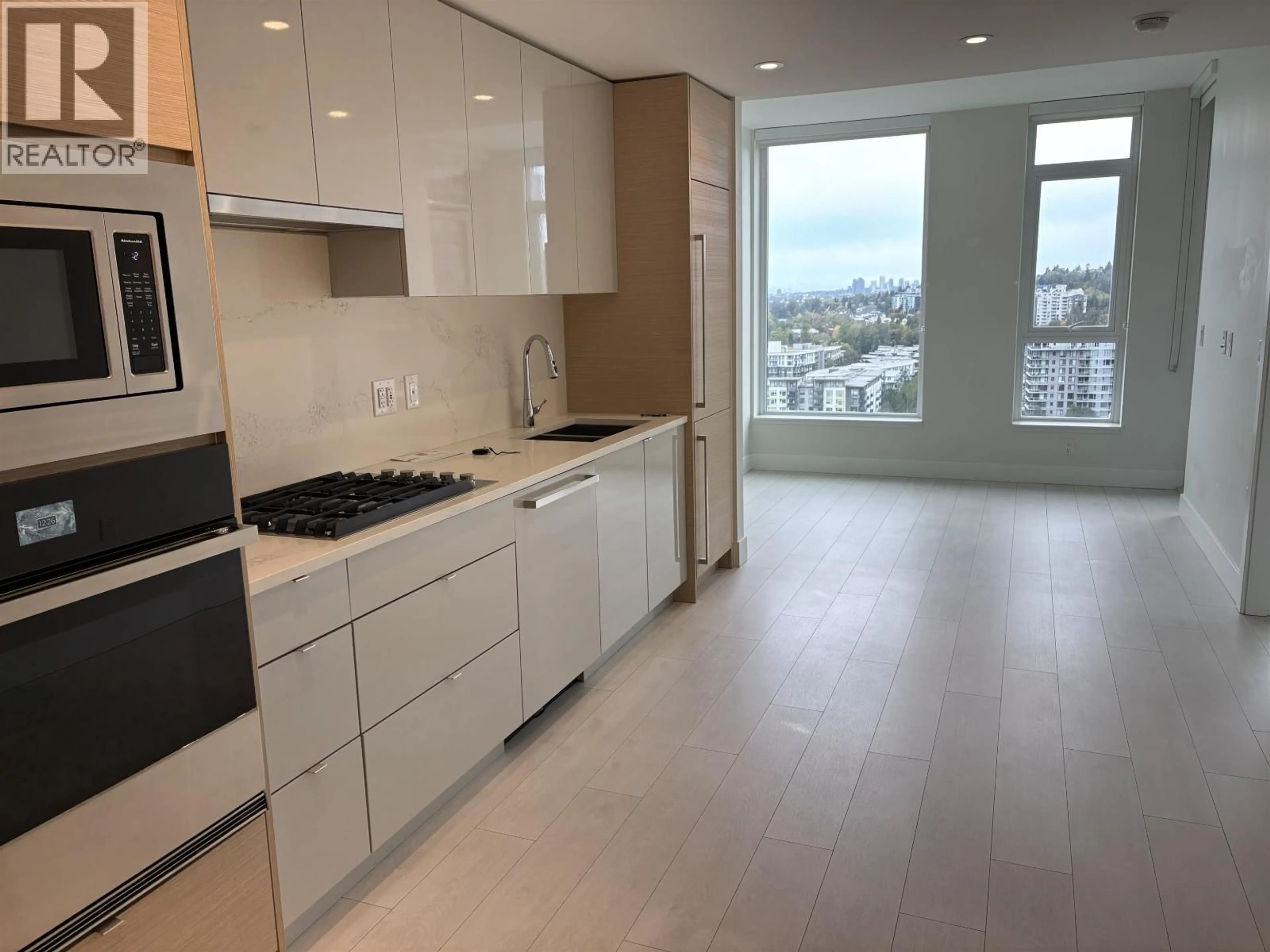 Open concept kitchen, ceramic/tile floor for 1804 - 3438 SAWMILL CRESCENT, Vancouver British Columbia V5S0E3