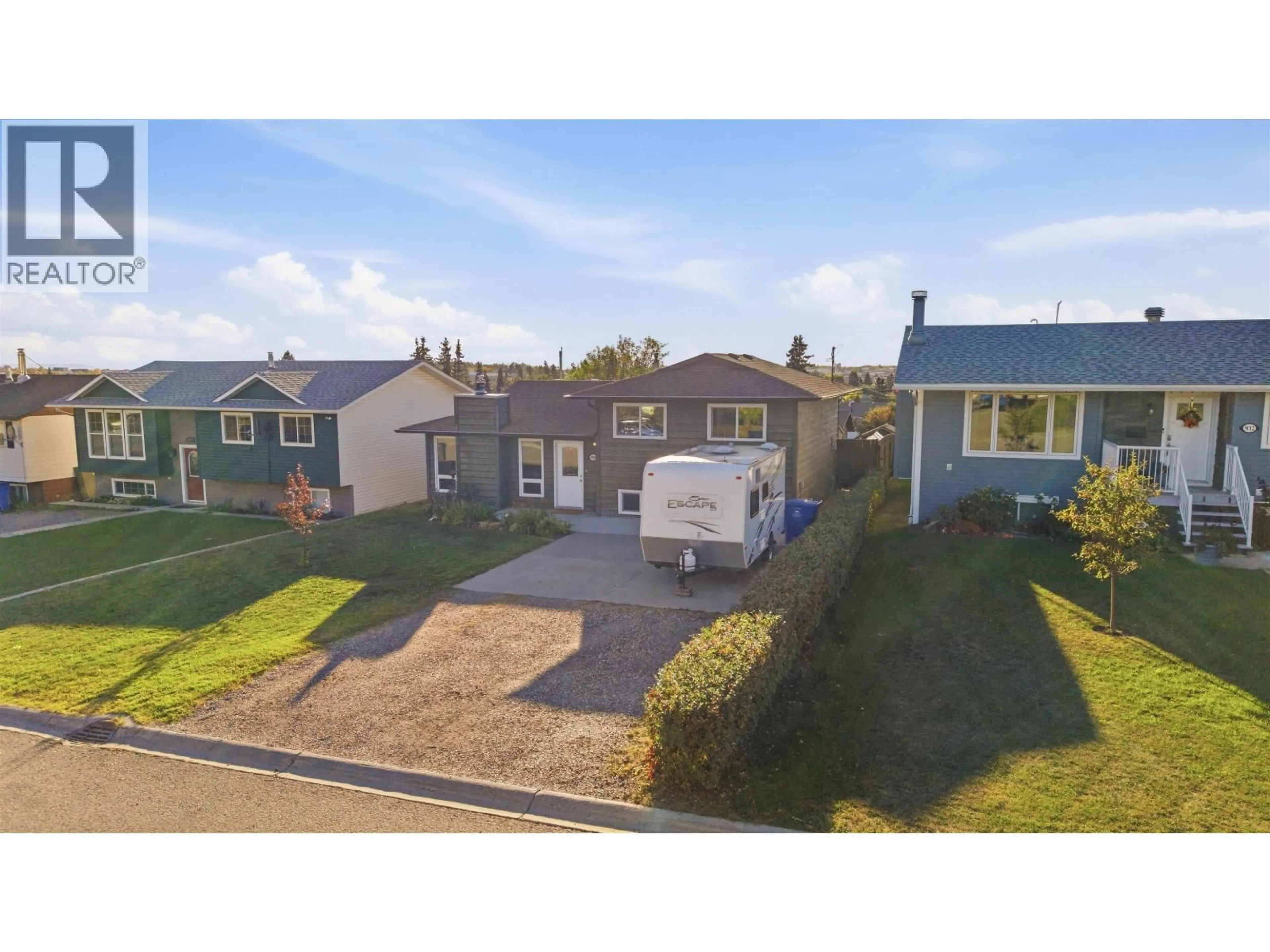 A pic from outside/outdoor area/front of a property/back of a property/a pic from drone, street for 9008 87 STREET, Fort St. John British Columbia V1J5H4