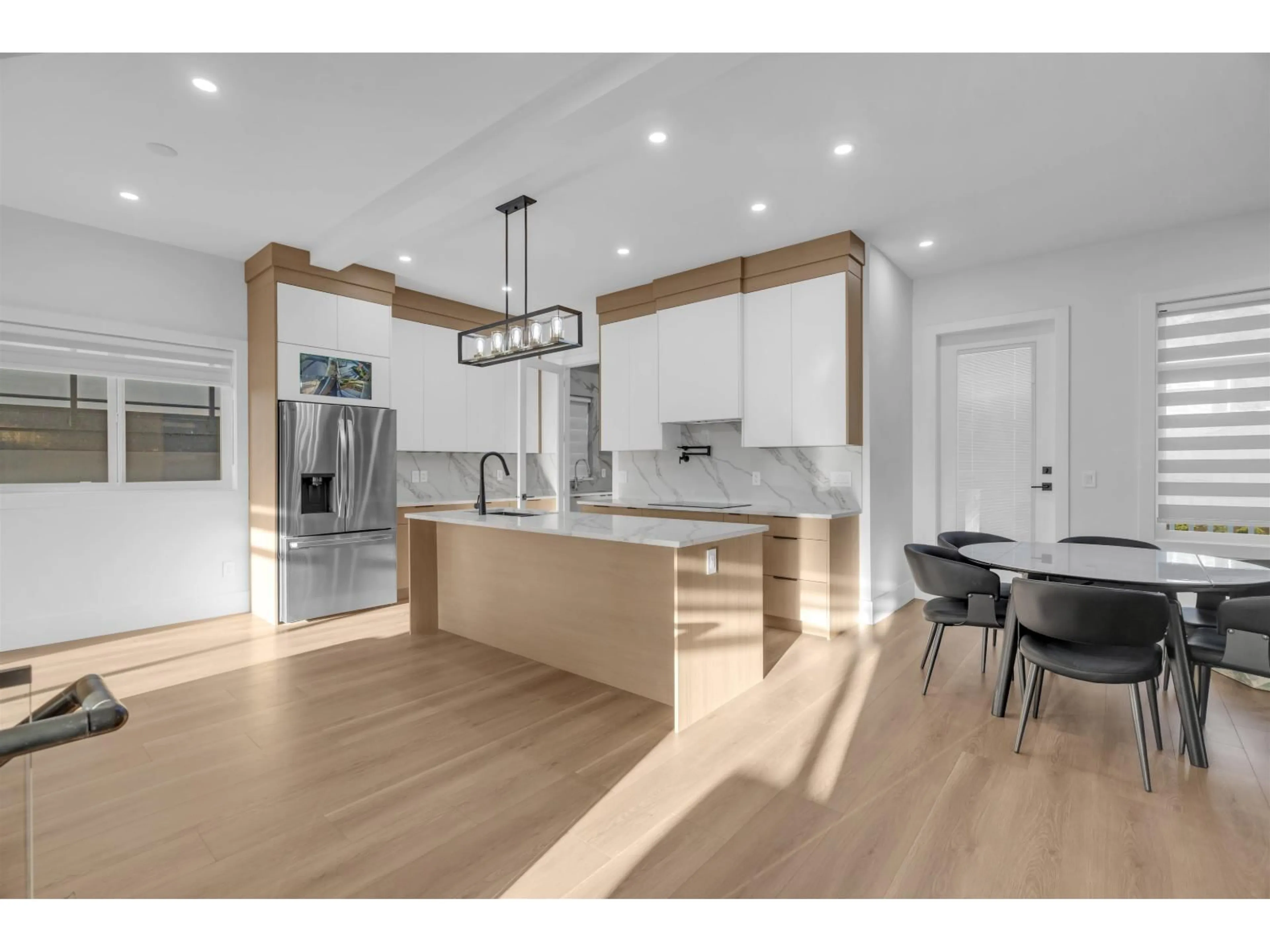 Open concept kitchen, wood/laminate floor for 102 - 11410 139 STREET, Surrey British Columbia V3R2M1