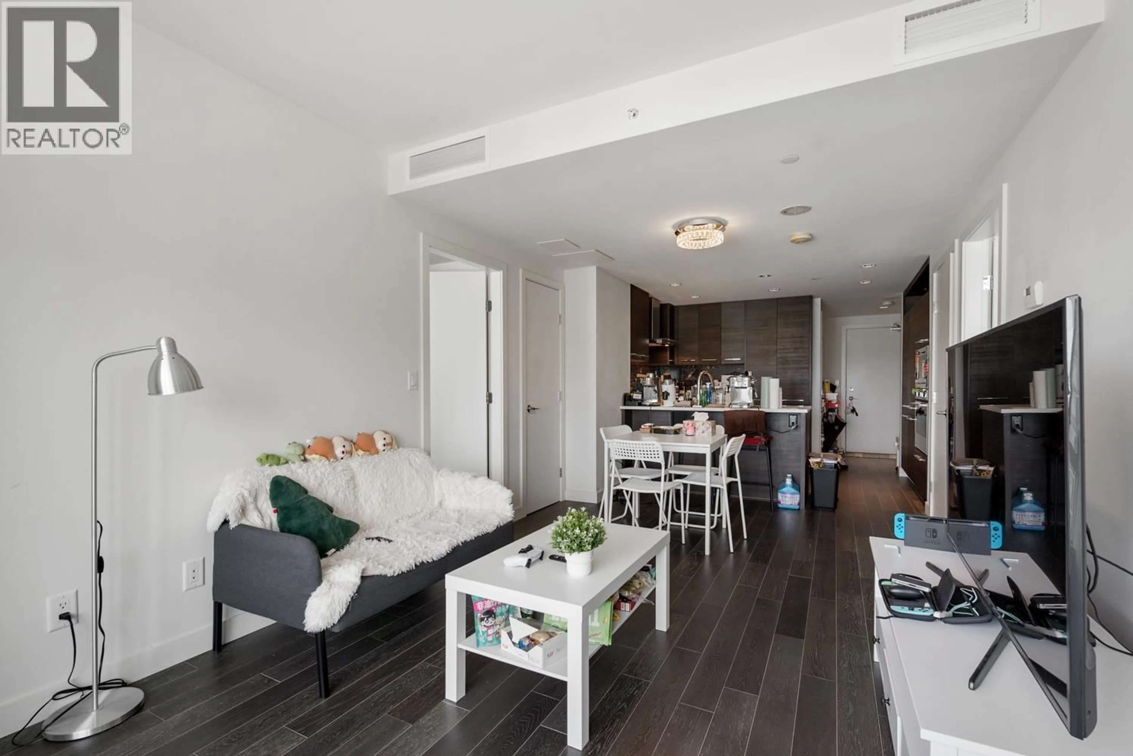 Living room with furniture, wood/laminate floor for 1007 - 7468 LANSDOWNE ROAD, Richmond British Columbia V7C0B7