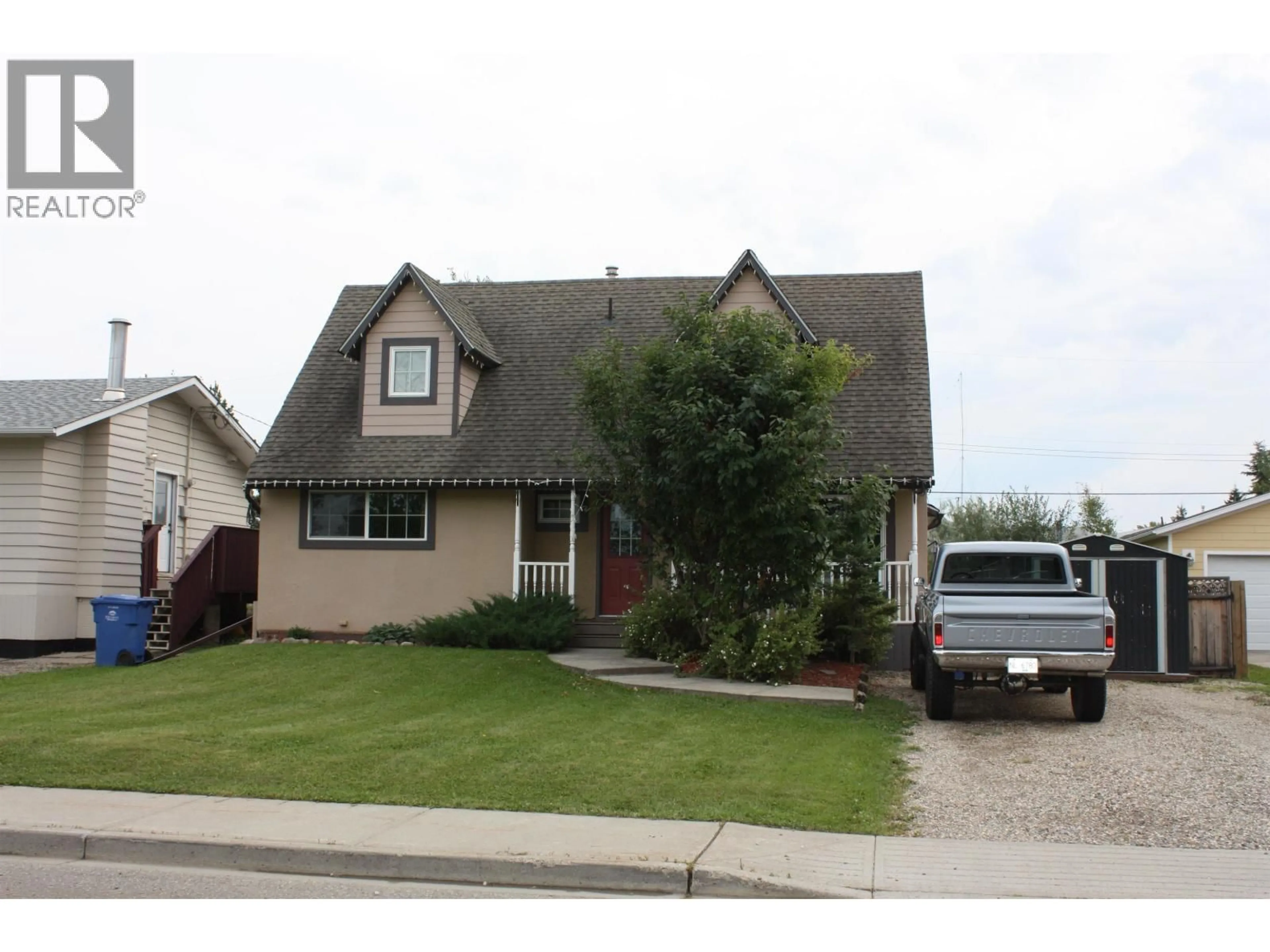 Home with vinyl exterior material, street for 10411 110 AVENUE, Fort St. John British Columbia V1J2T5