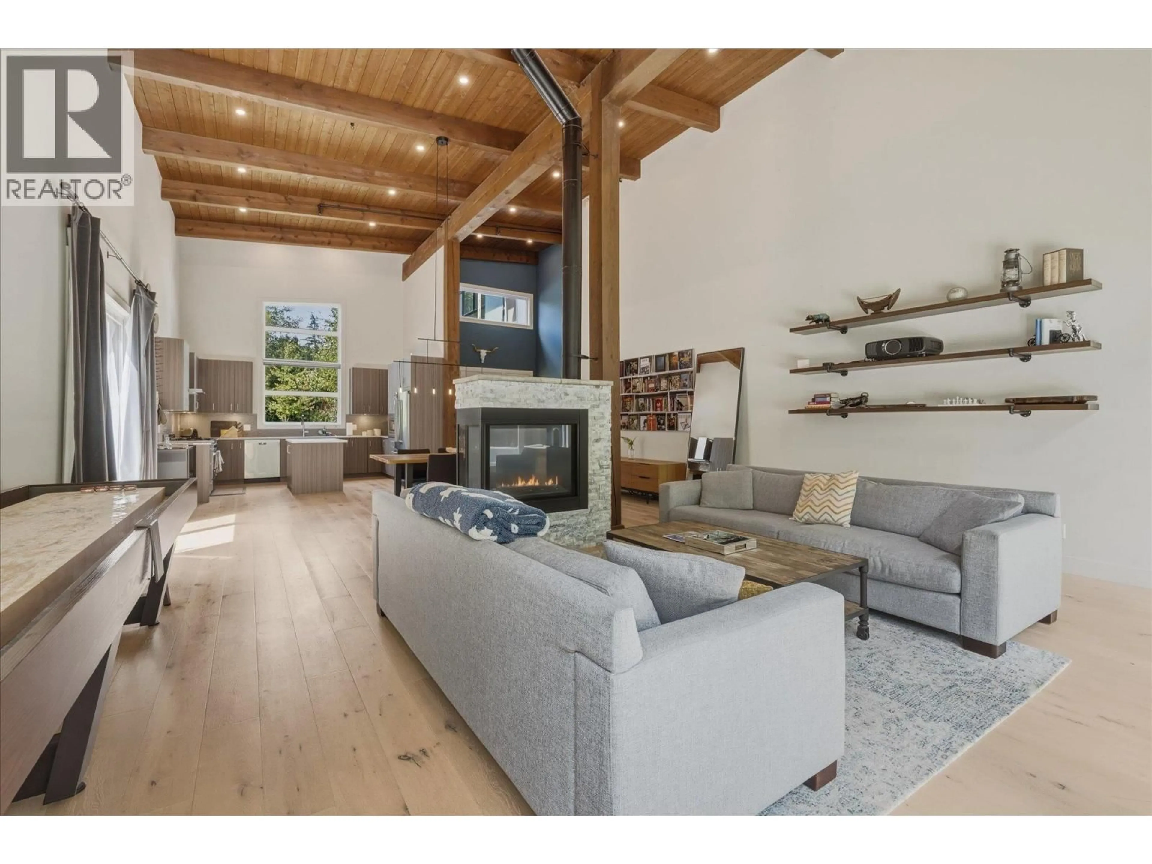 Living room with furniture, wood/laminate floor for 3324 MAMQUAM ROAD, Squamish British Columbia V8B0S6