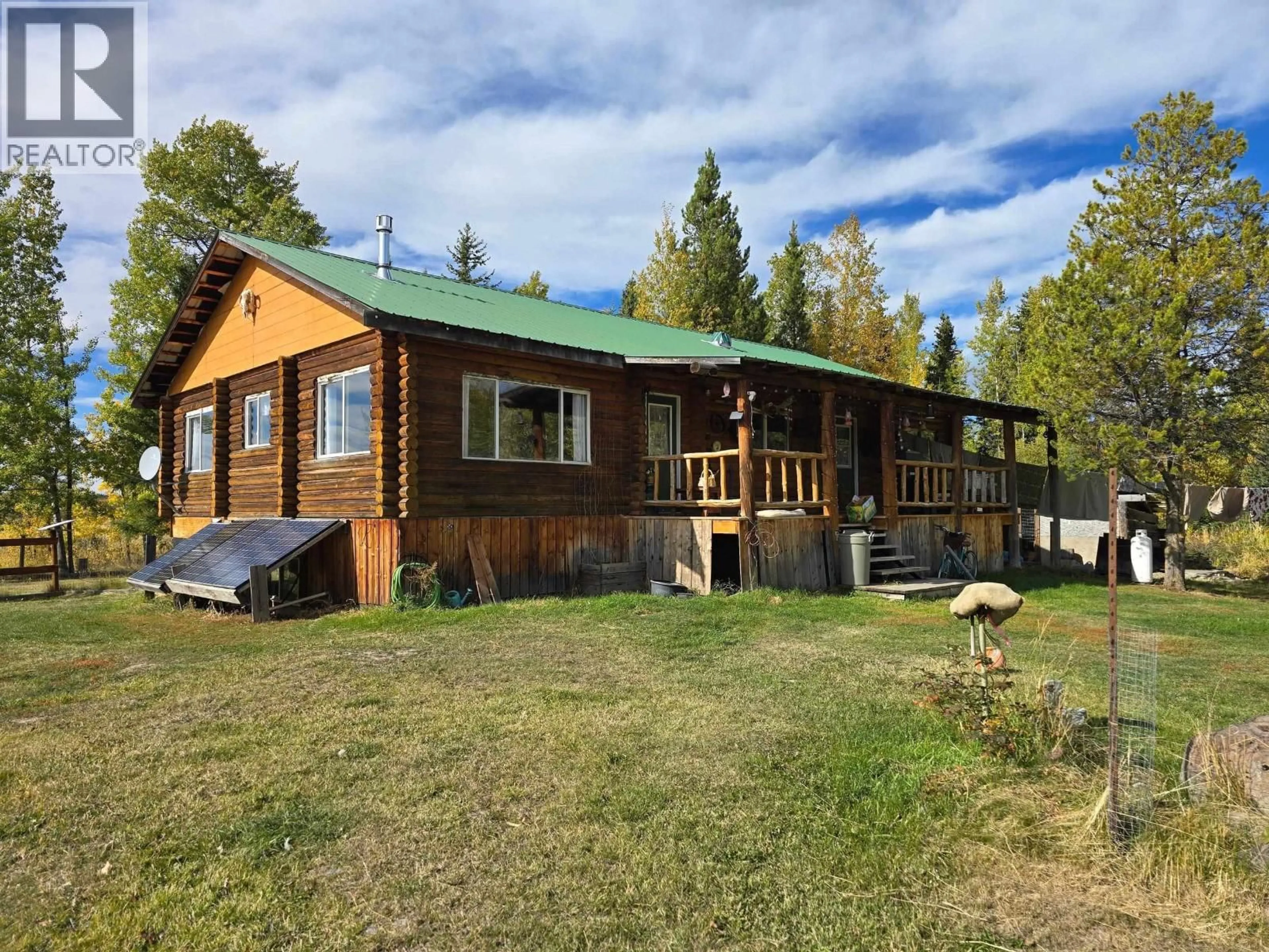 A pic from outside/outdoor area/front of a property/back of a property/a pic from drone, unknown for 495 JACKPINE ROAD, 150 Mile House British Columbia V0K2G0