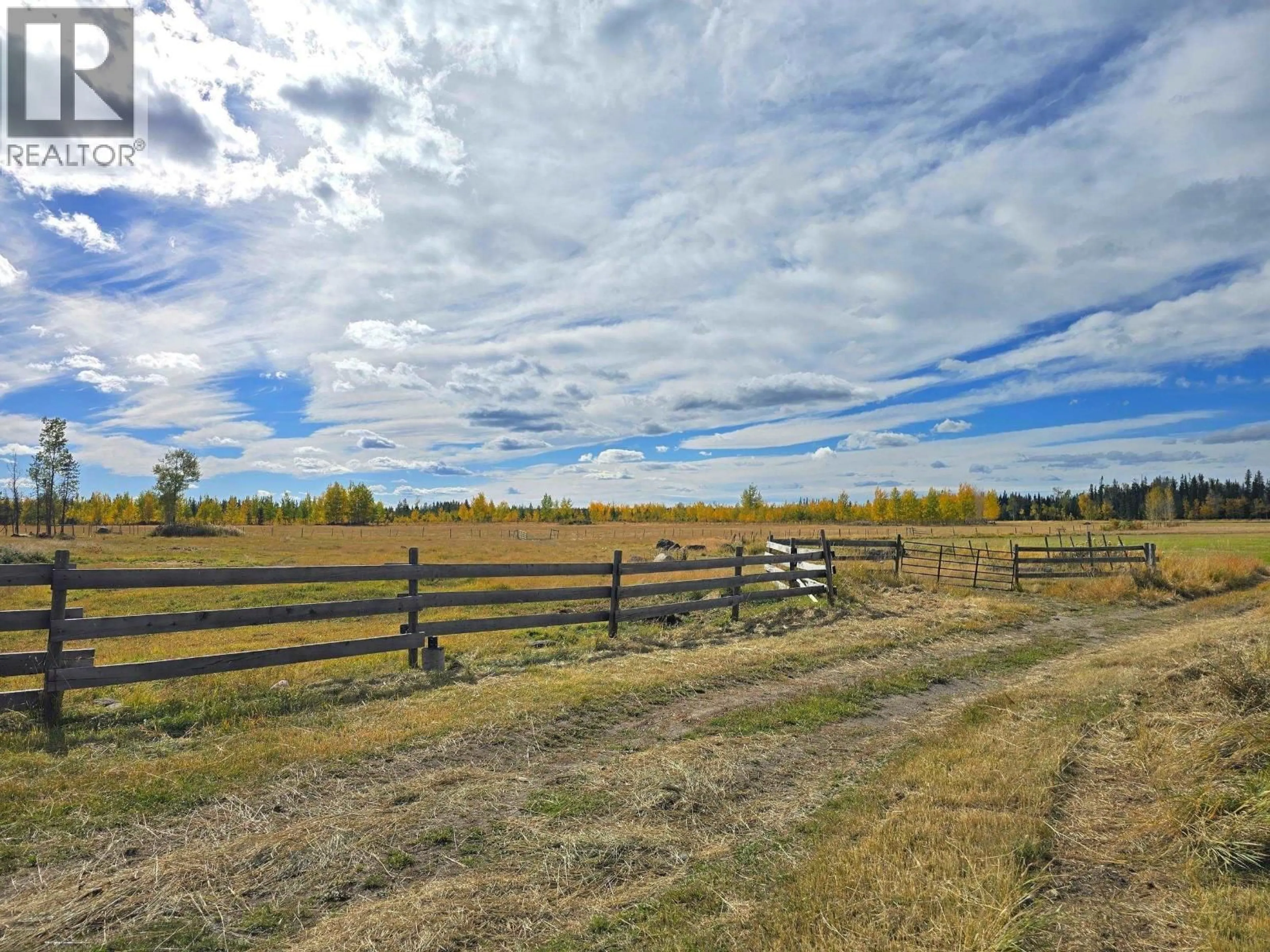 A pic from outside/outdoor area/front of a property/back of a property/a pic from drone, unknown for 495 JACKPINE ROAD, 150 Mile House British Columbia V0K2G0