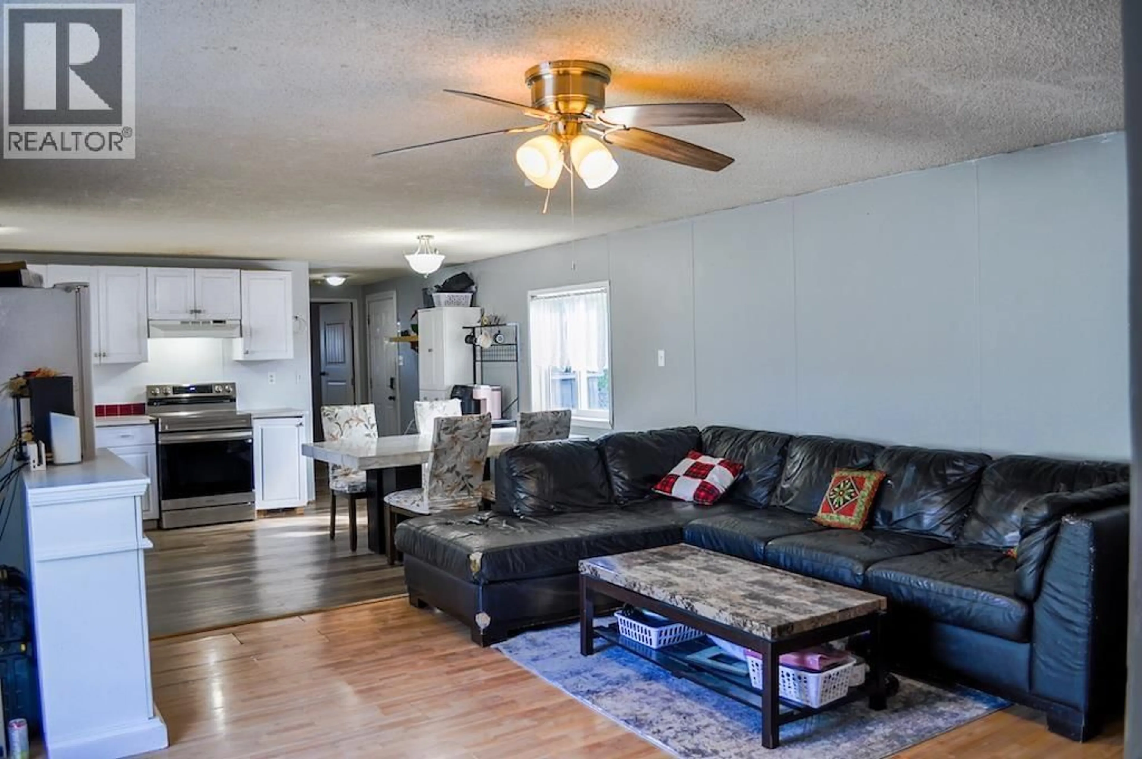 Living room with furniture, wood/laminate floor for 10547 101 STREET, Taylor British Columbia V0C2K0