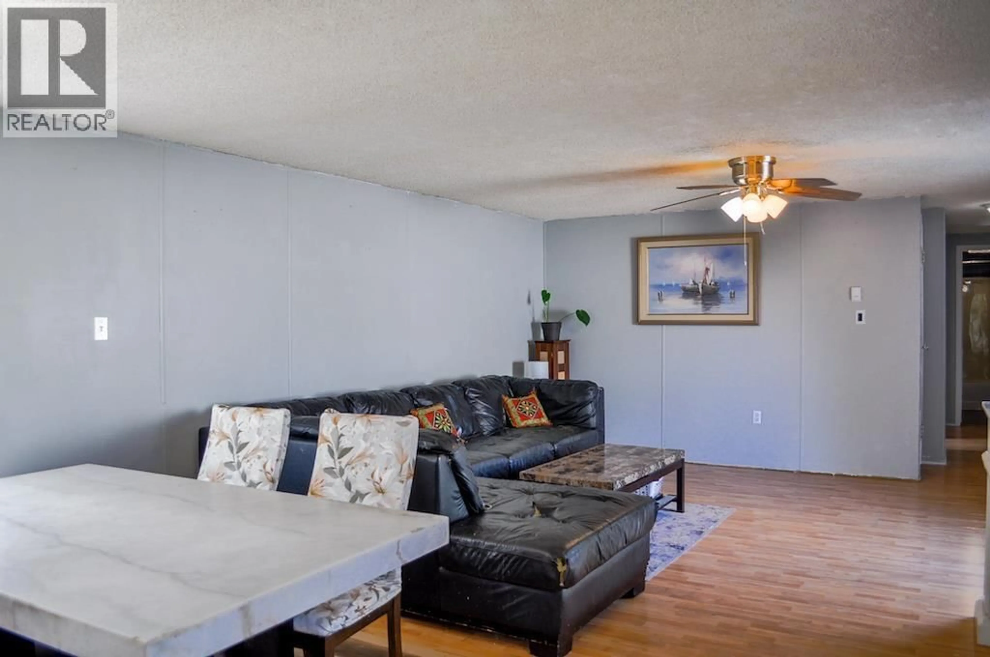 Living room with furniture, wood/laminate floor for 10547 101 STREET, Taylor British Columbia V0C2K0