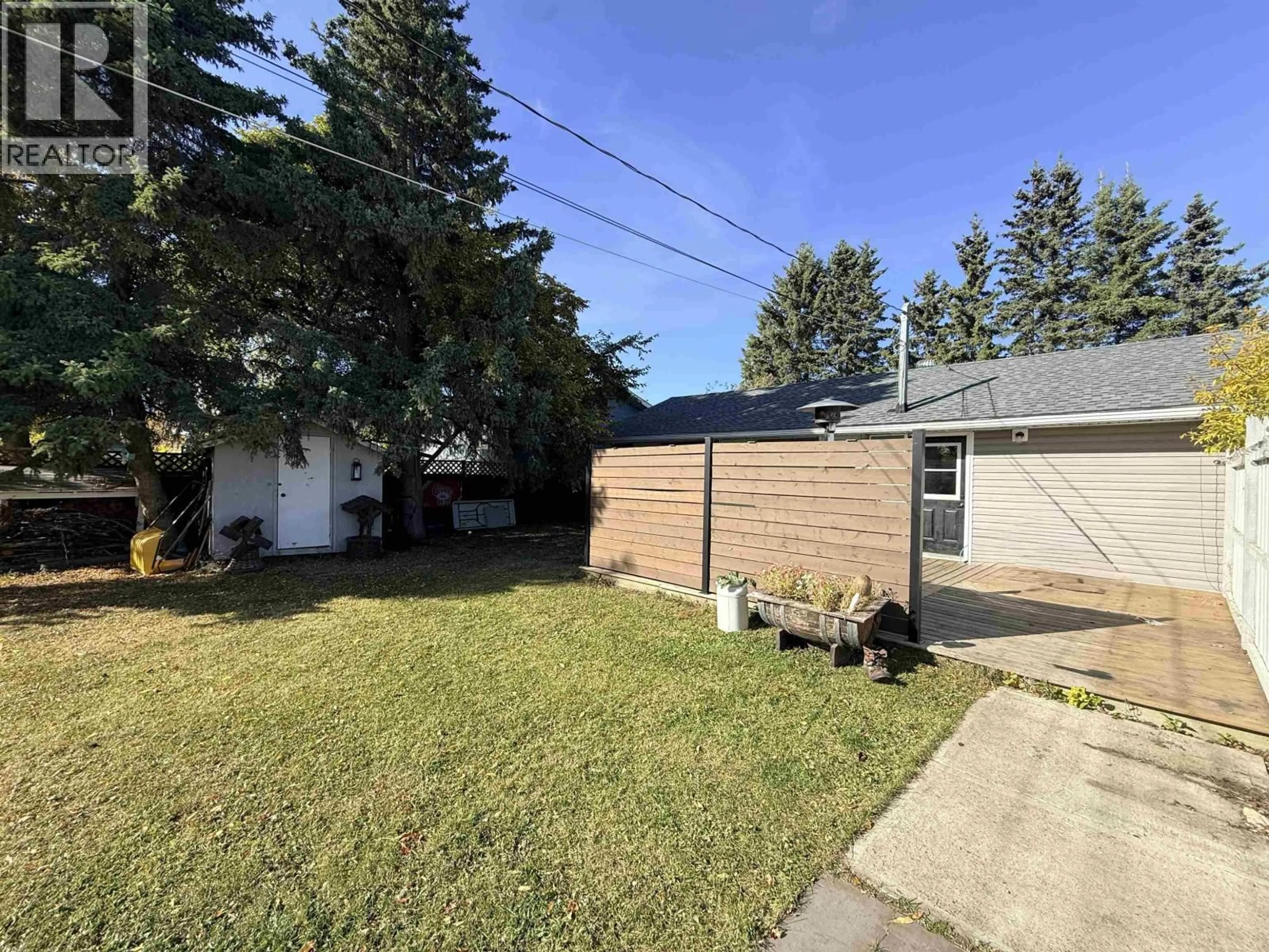 A pic from outside/outdoor area/front of a property/back of a property/a pic from drone, street for 9203 104 AVENUE, Fort St. John British Columbia V1J2J6