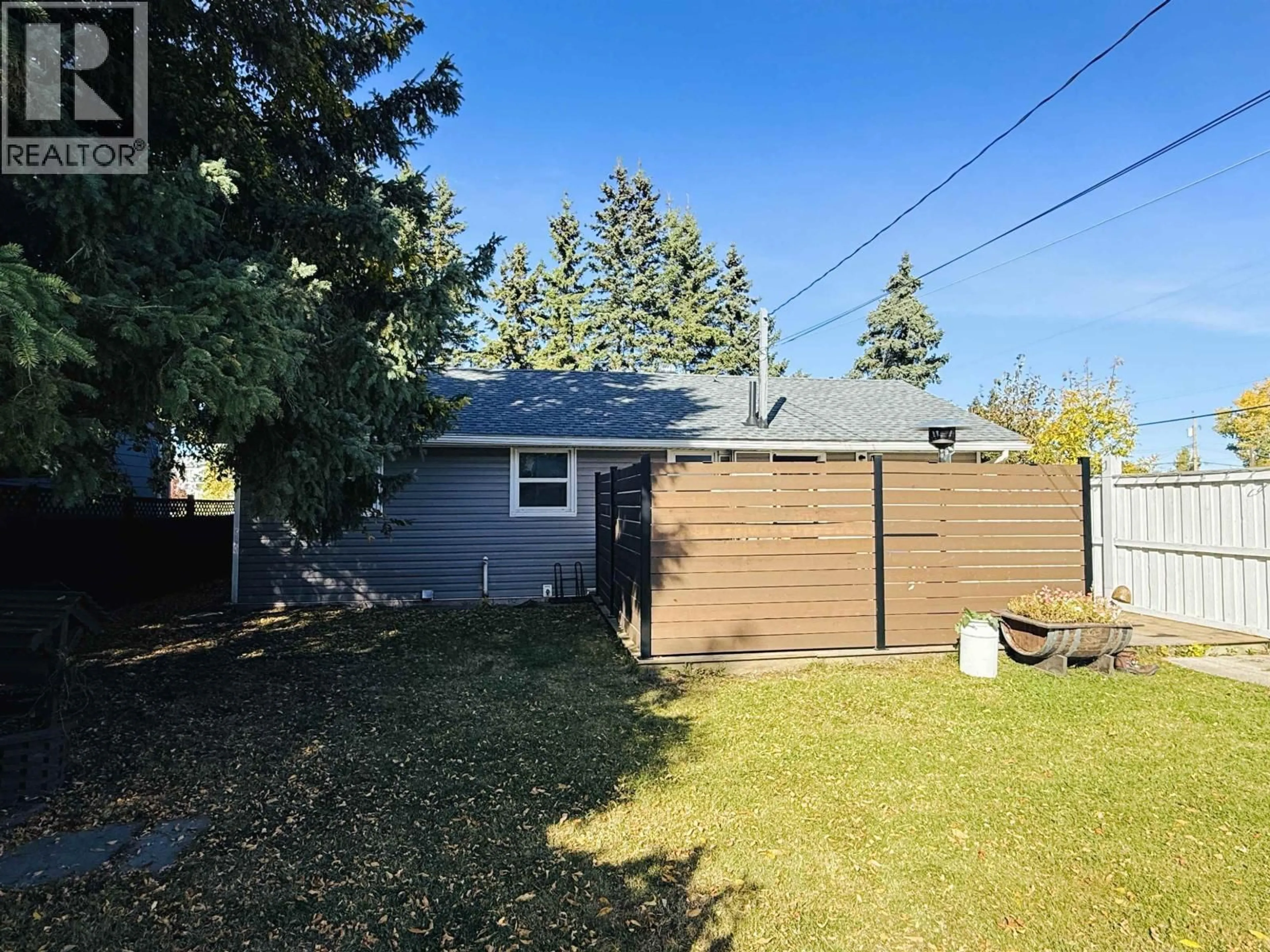 A pic from outside/outdoor area/front of a property/back of a property/a pic from drone, street for 9203 104 AVENUE, Fort St. John British Columbia V1J2J6