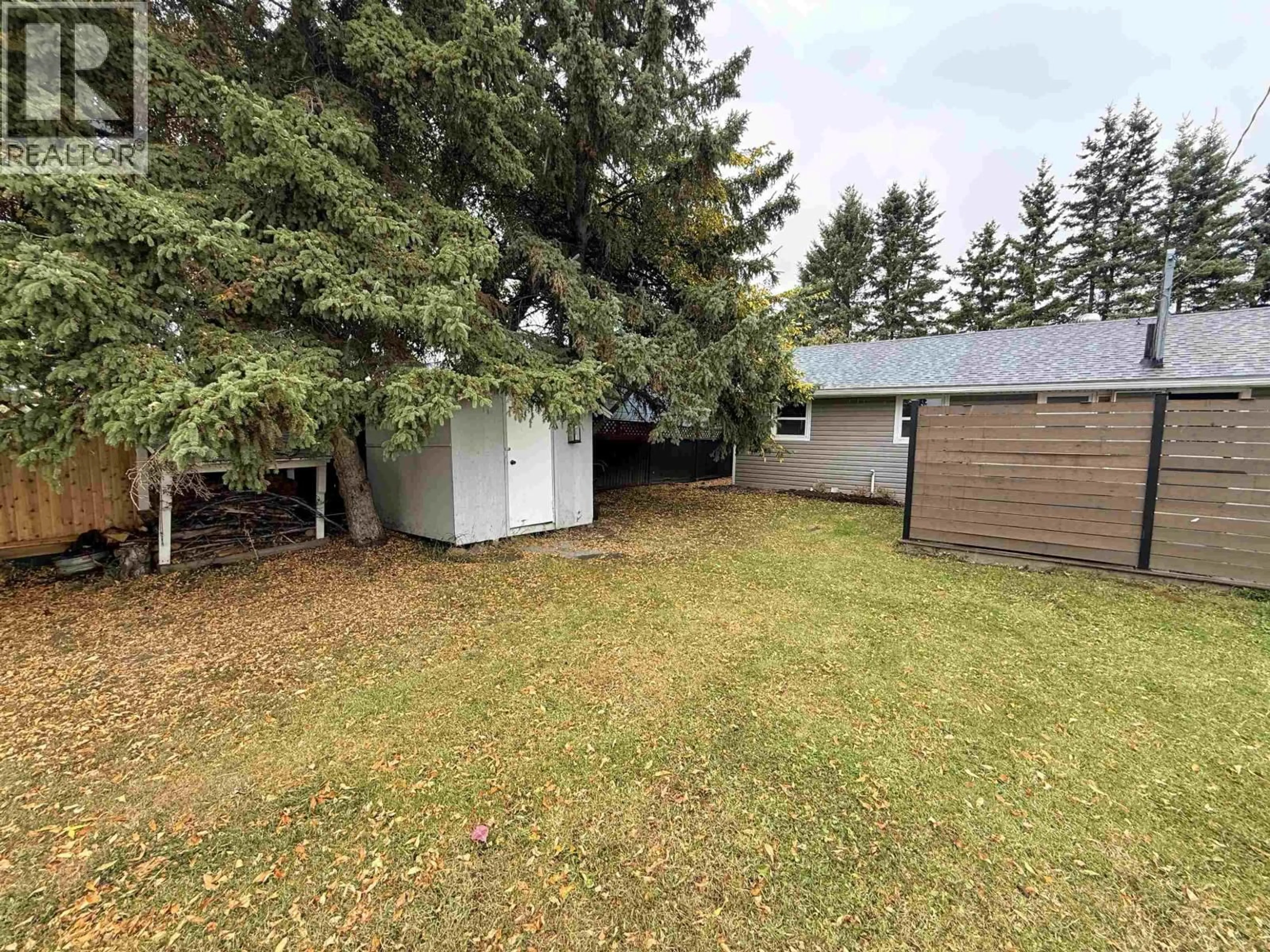 A pic from outside/outdoor area/front of a property/back of a property/a pic from drone, unknown for 9203 104 AVENUE, Fort St. John British Columbia V1J2J6