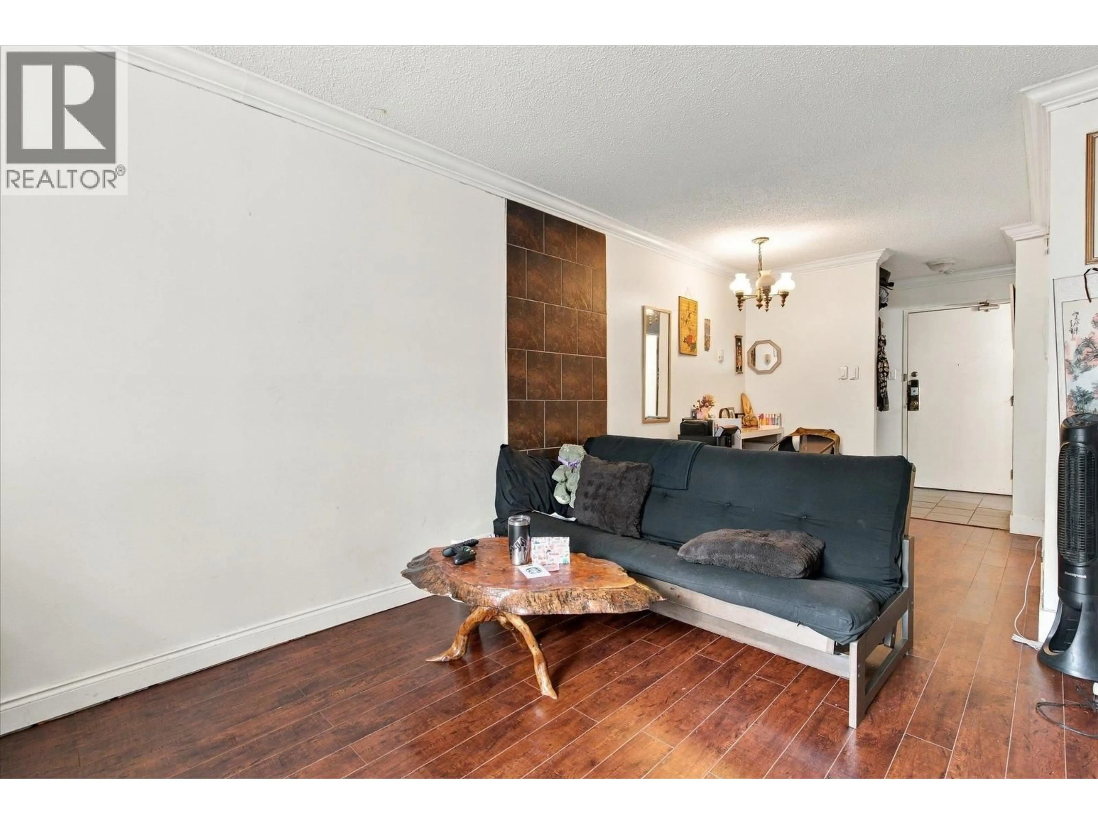 Living room with furniture, wood/laminate floor for 107 - 830 7TH AVENUE, Vancouver British Columbia V5T4J2