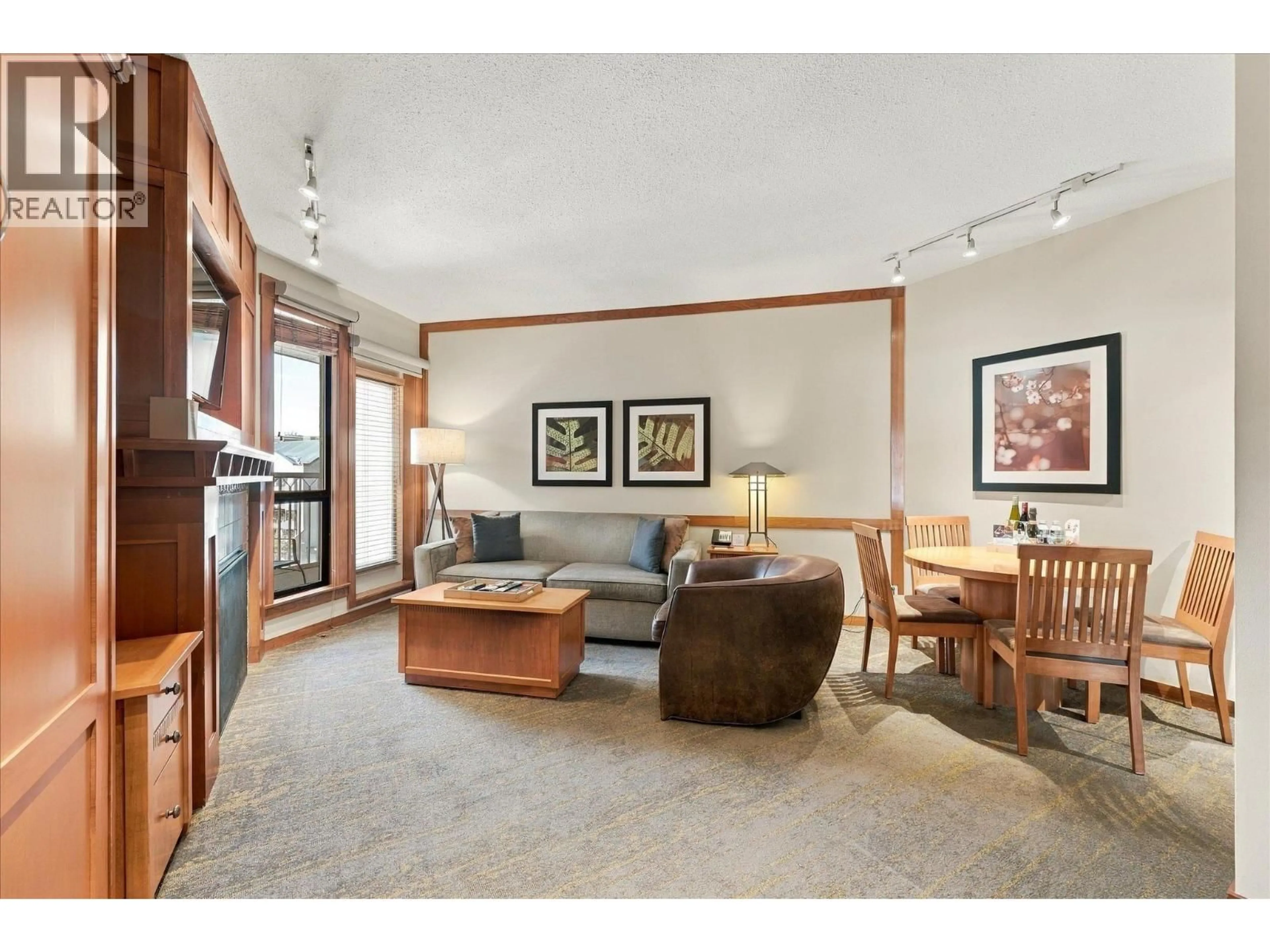 Living room with furniture, wood/laminate floor for 520 - 4320 SUNDIAL CRESCENT, Whistler British Columbia V8E1G6