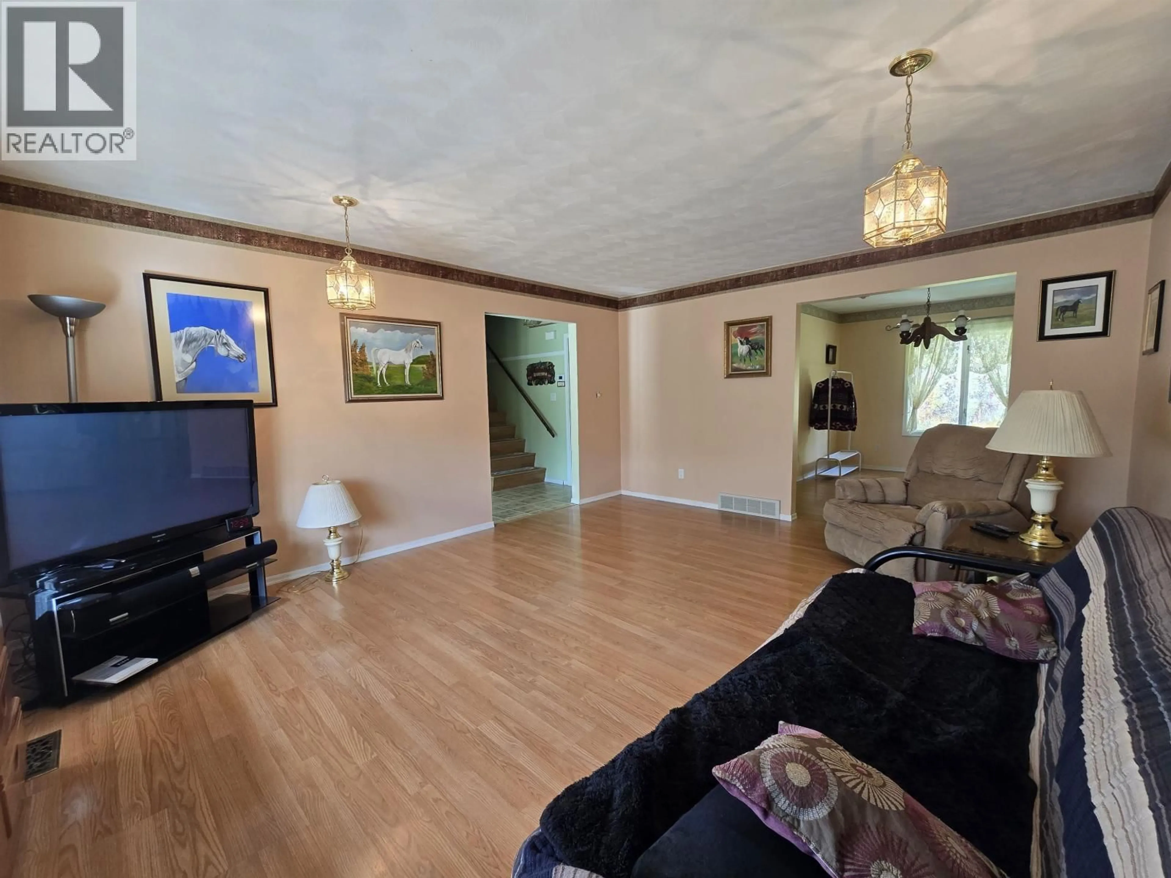 Living room with furniture, wood/laminate floor for 4706 NORTH MEADOW ROAD, Prince George British Columbia V2K4K1