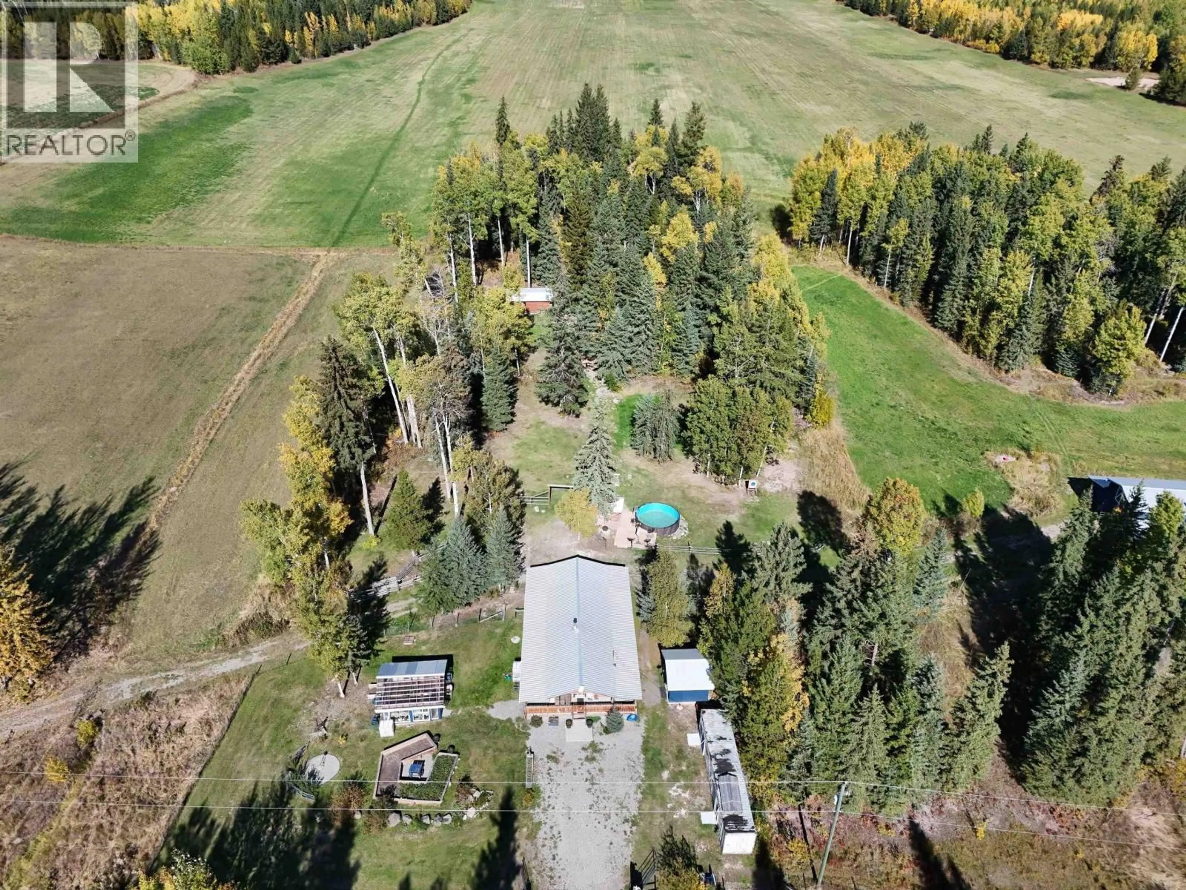 A pic from outside/outdoor area/front of a property/back of a property/a pic from drone, forest/trees view for 2226 GARNER ROAD, Quesnel British Columbia V2J6H6