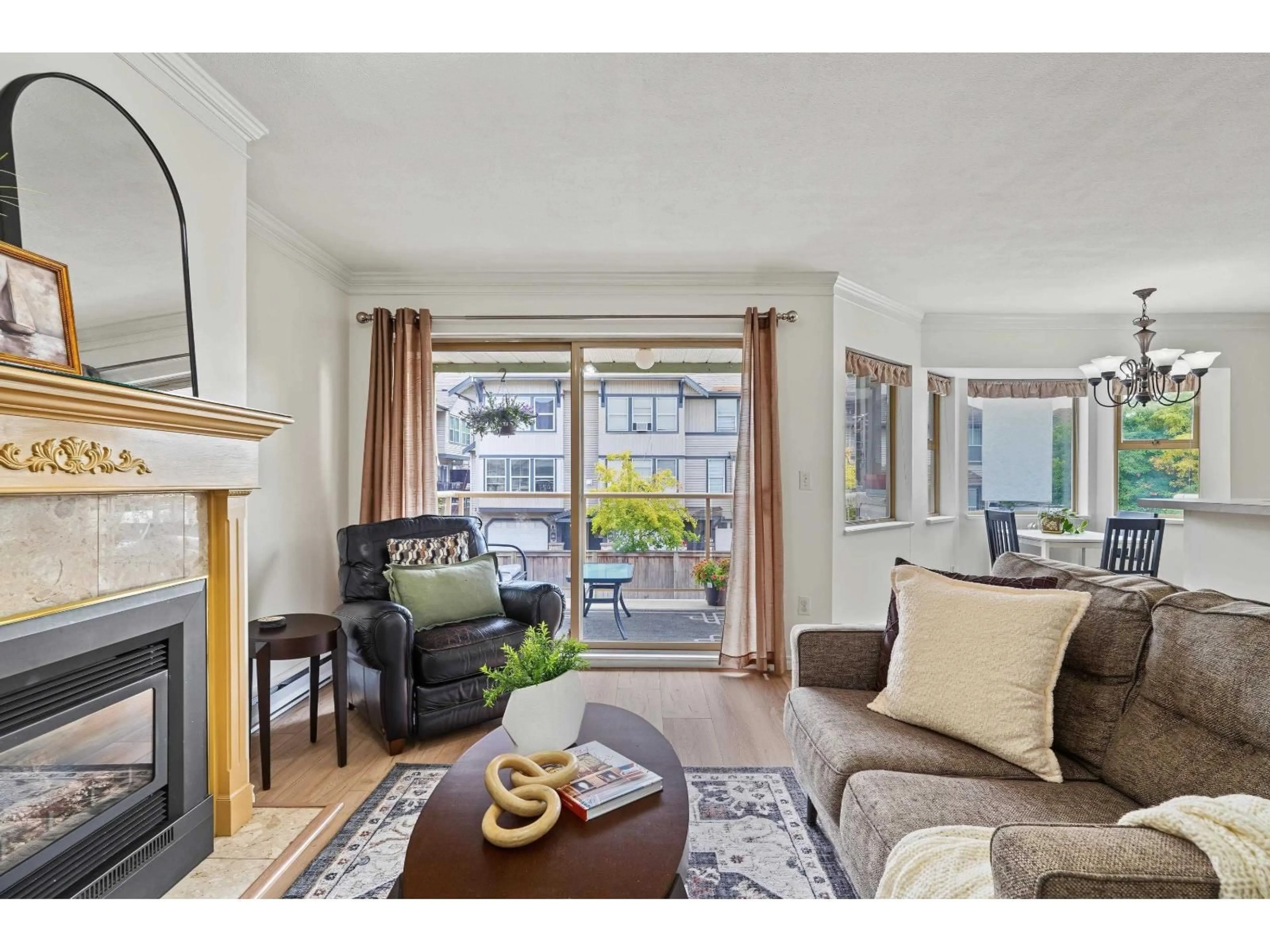 Living room with furniture, wood/laminate floor for 204 - 5464 201A STREET, Langley British Columbia V3A1S8