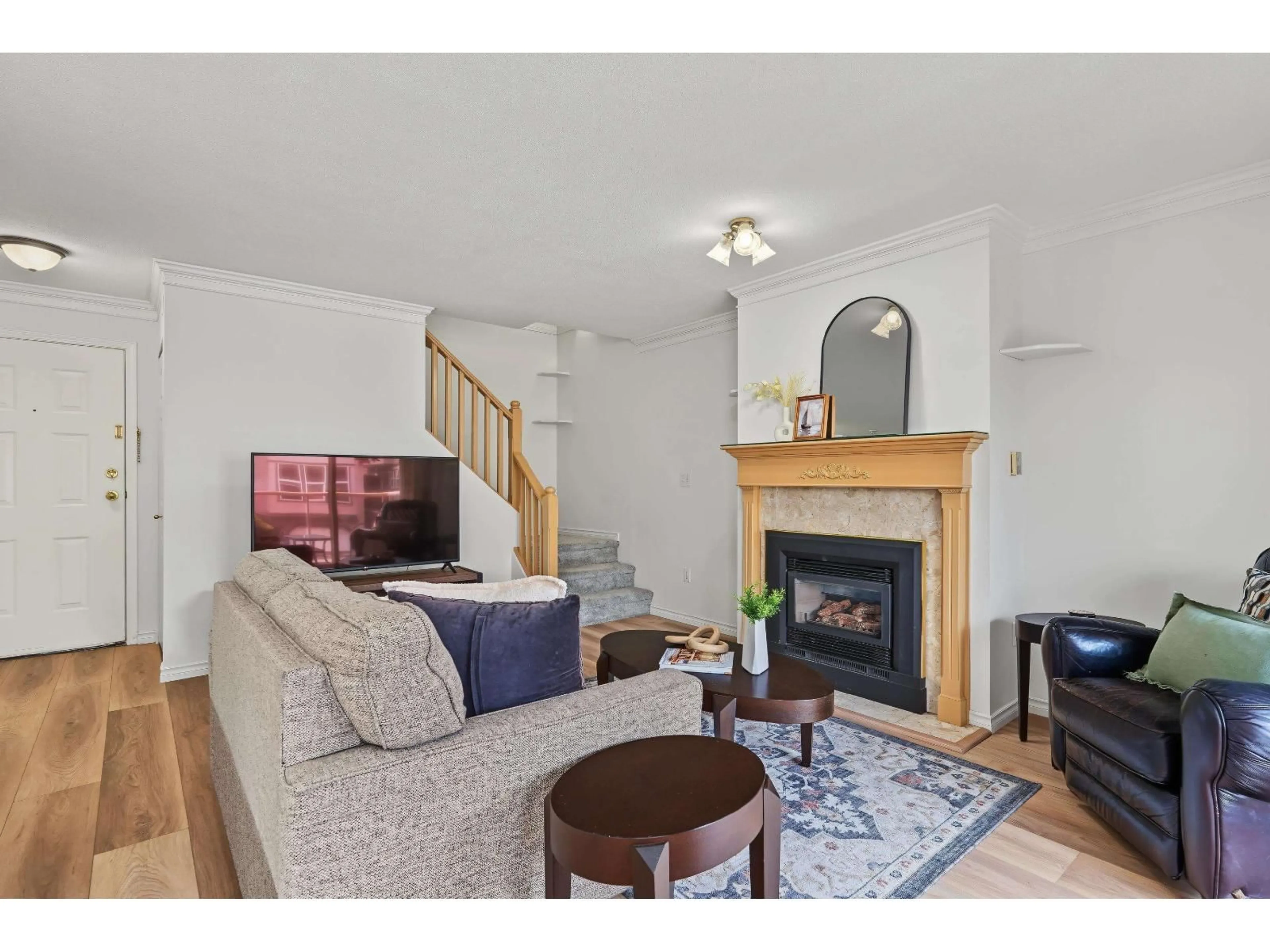 Living room with furniture, wood/laminate floor for 204 - 5464 201A STREET, Langley British Columbia V3A1S8