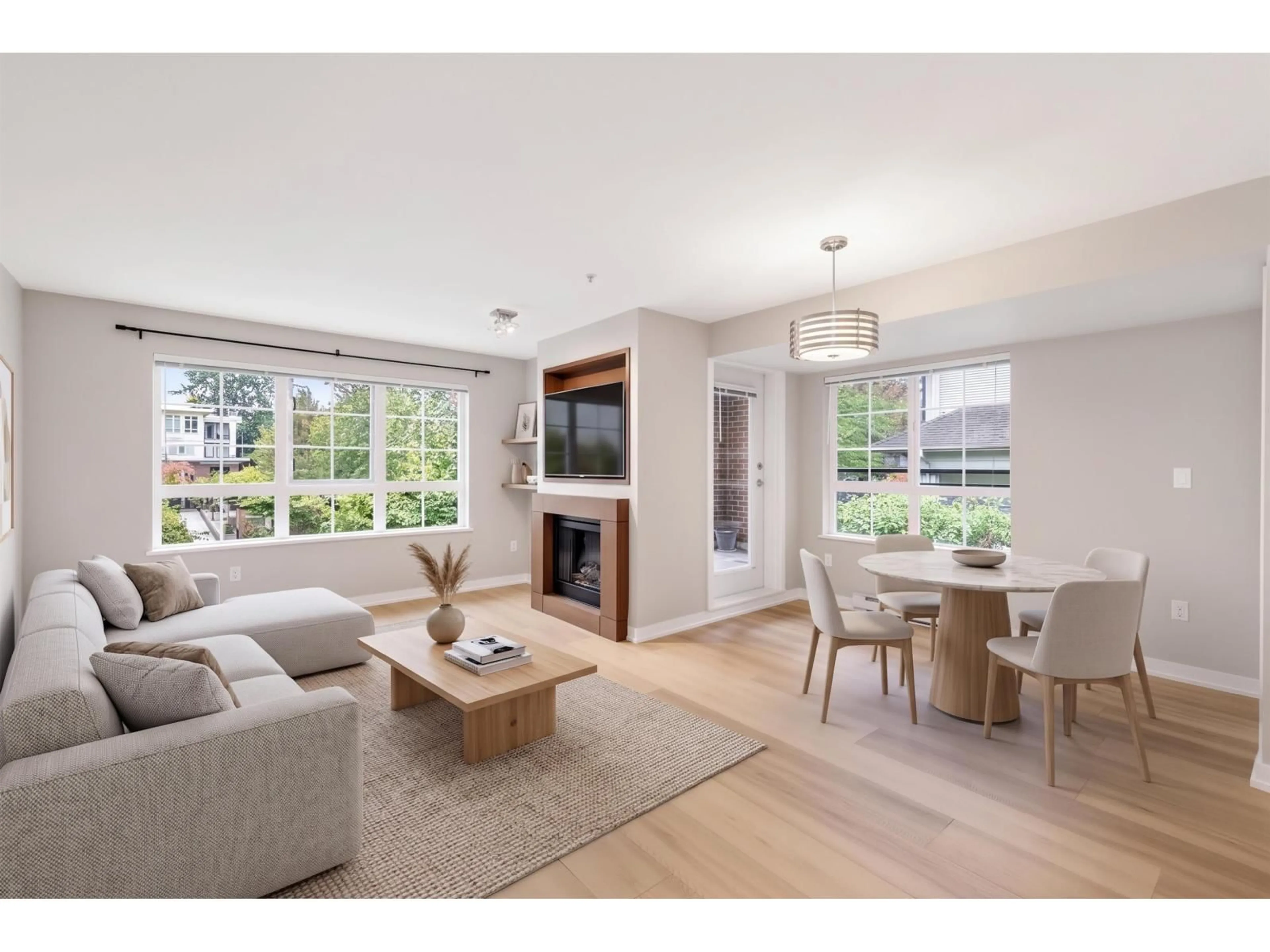 Living room with furniture, wood/laminate floor for 205 - 2940 KING GEORGE BOULEVARD, Surrey British Columbia V4P1A2