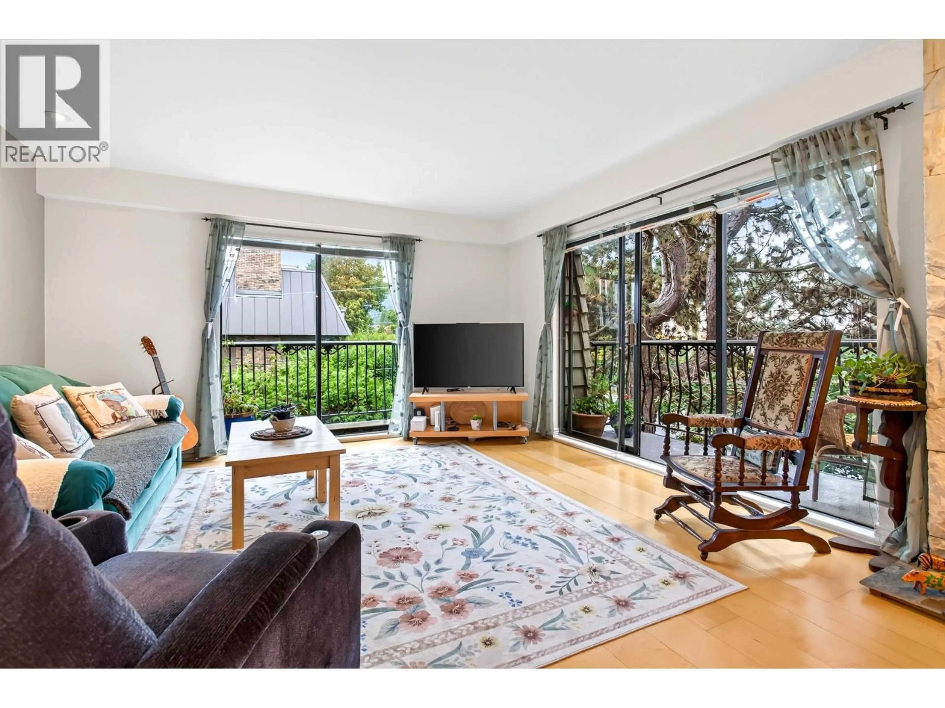 Living room with furniture, wood/laminate floor for 303 - 1721 ST. GEORGES AVENUE, North Vancouver British Columbia V7L3J8