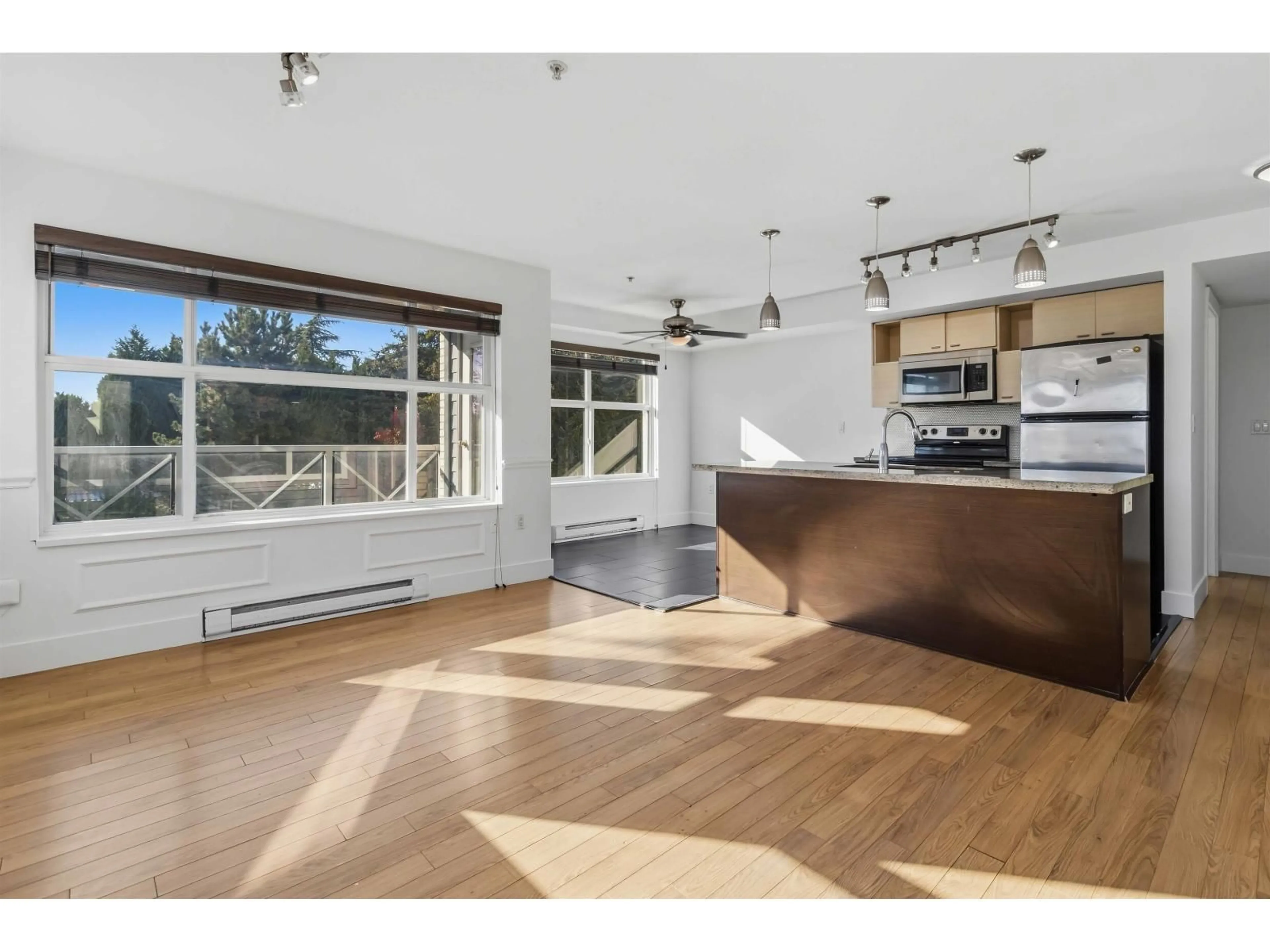 Open concept kitchen, wood/laminate floor for 204 - 7445 120 STREET, Delta British Columbia V4C0B3