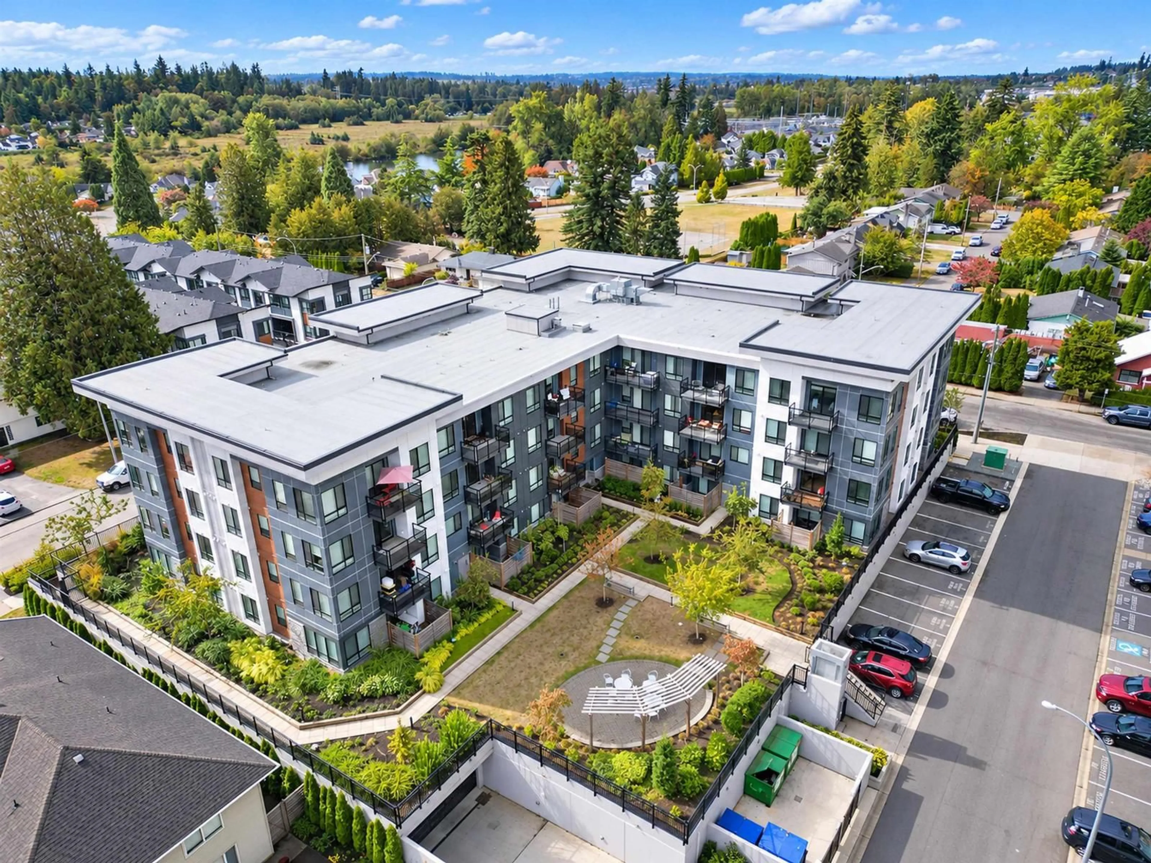 A pic from outside/outdoor area/front of a property/back of a property/a pic from drone, city buildings view from balcony for 409 - 19825 54 AVENUE, Langley British Columbia V3A0P6