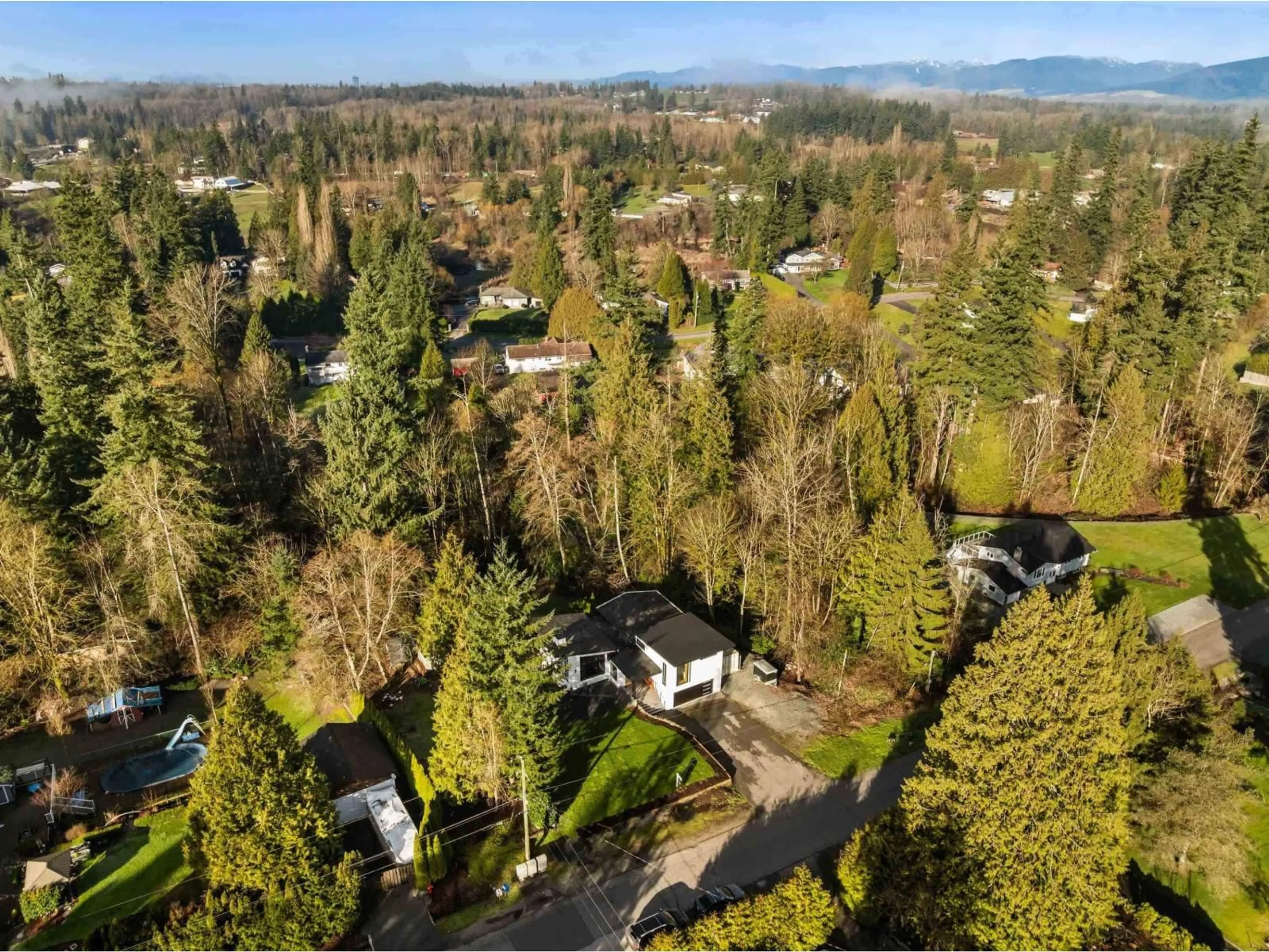 A pic from outside/outdoor area/front of a property/back of a property/a pic from drone, forest/trees view for 7869 229 STREET, Langley British Columbia V1M2J6