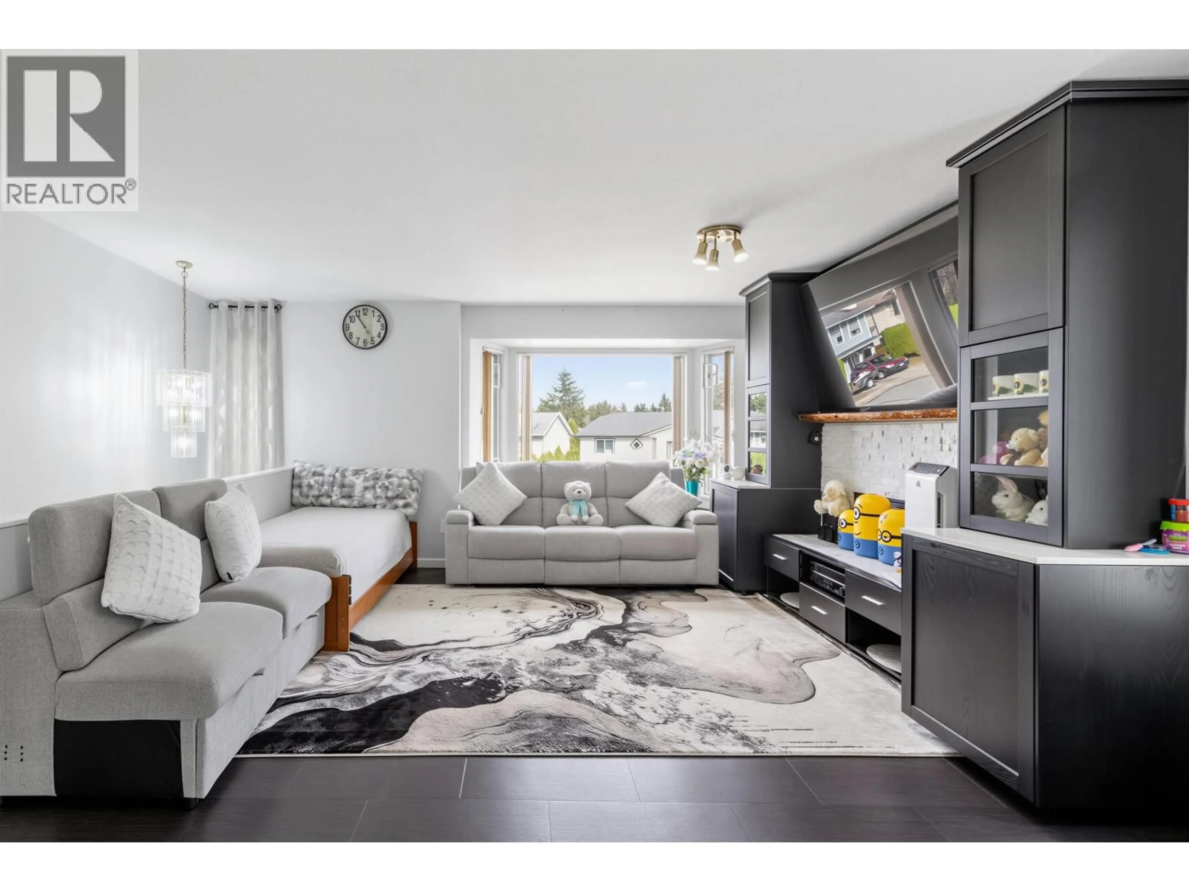 Living room with furniture, wood/laminate floor for 22442 125 AVENUE, Maple Ridge British Columbia V2X9N7