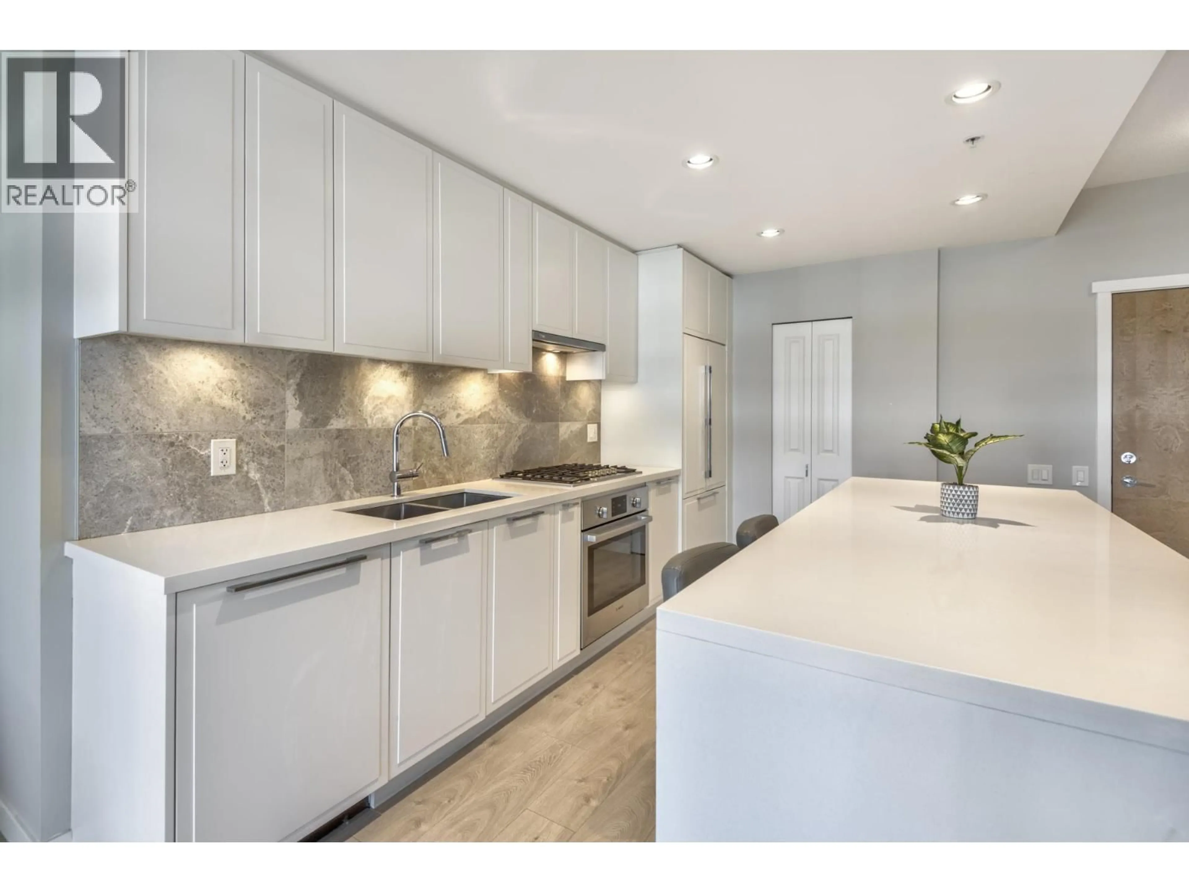 Contemporary kitchen, ceramic/tile floor for 409 - 3188 RIVERWALK AVENUE, Vancouver British Columbia V5S0E7