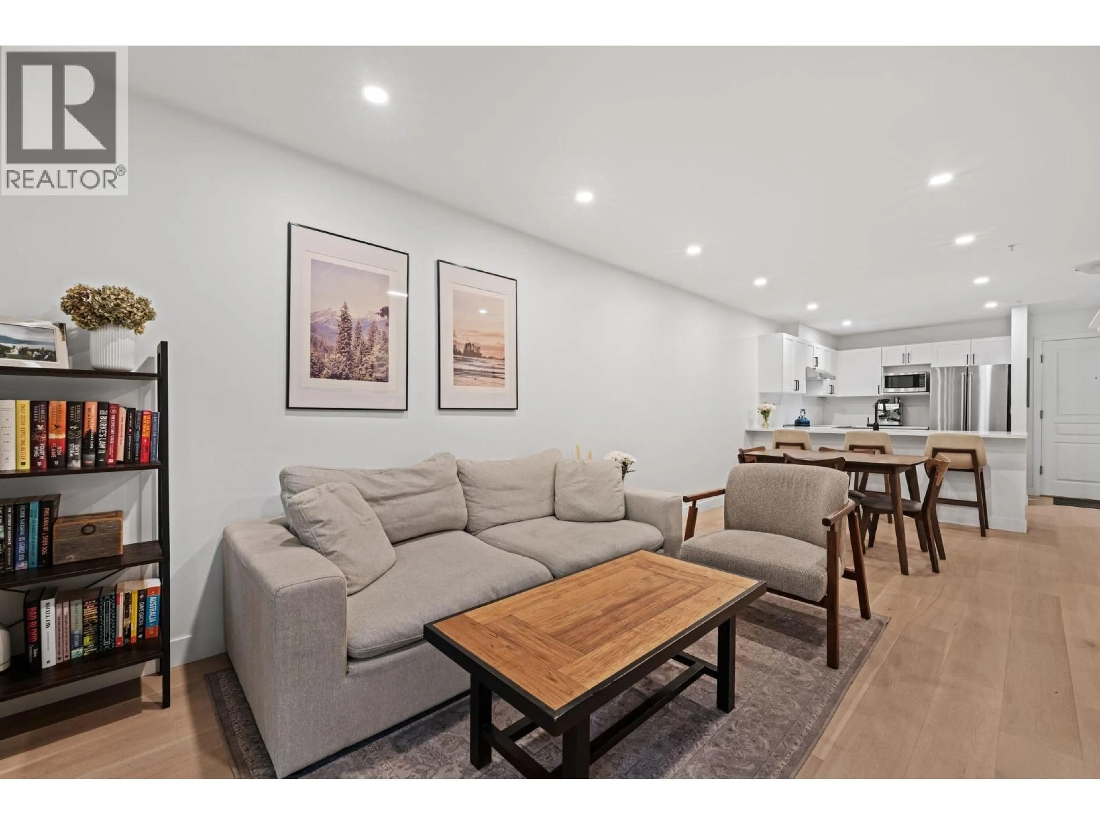 Living room with furniture, wood/laminate floor for 118 - 365 1ST STREET, North Vancouver British Columbia V7L4W5