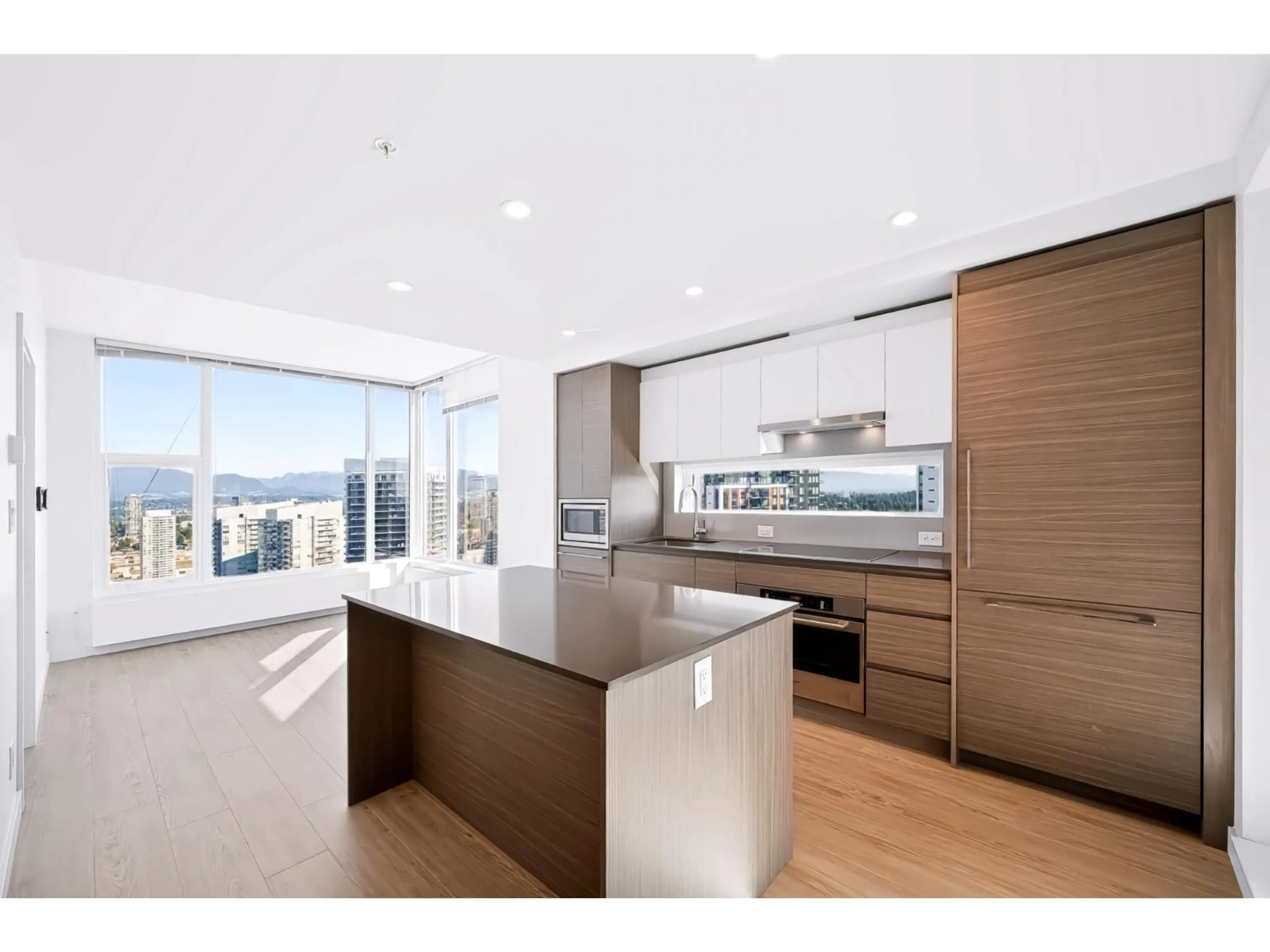 Open concept kitchen, wood/laminate floor for 3908 - 13615 FRASER HIGHWAY, Surrey British Columbia V3T0P7