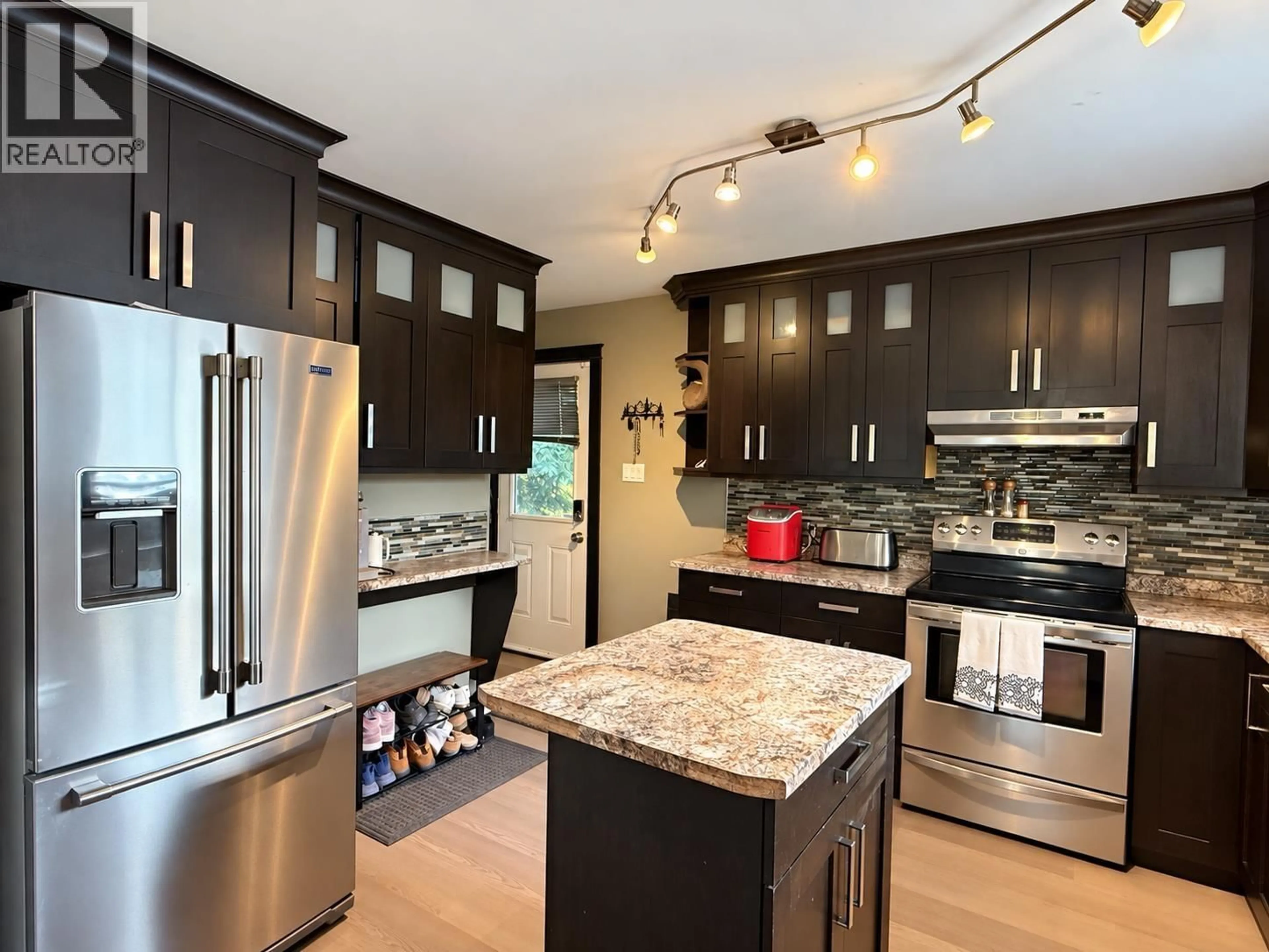 Contemporary kitchen, wood/laminate floor for 7106 MOOSE ROAD, Prince George British Columbia V2N5N8