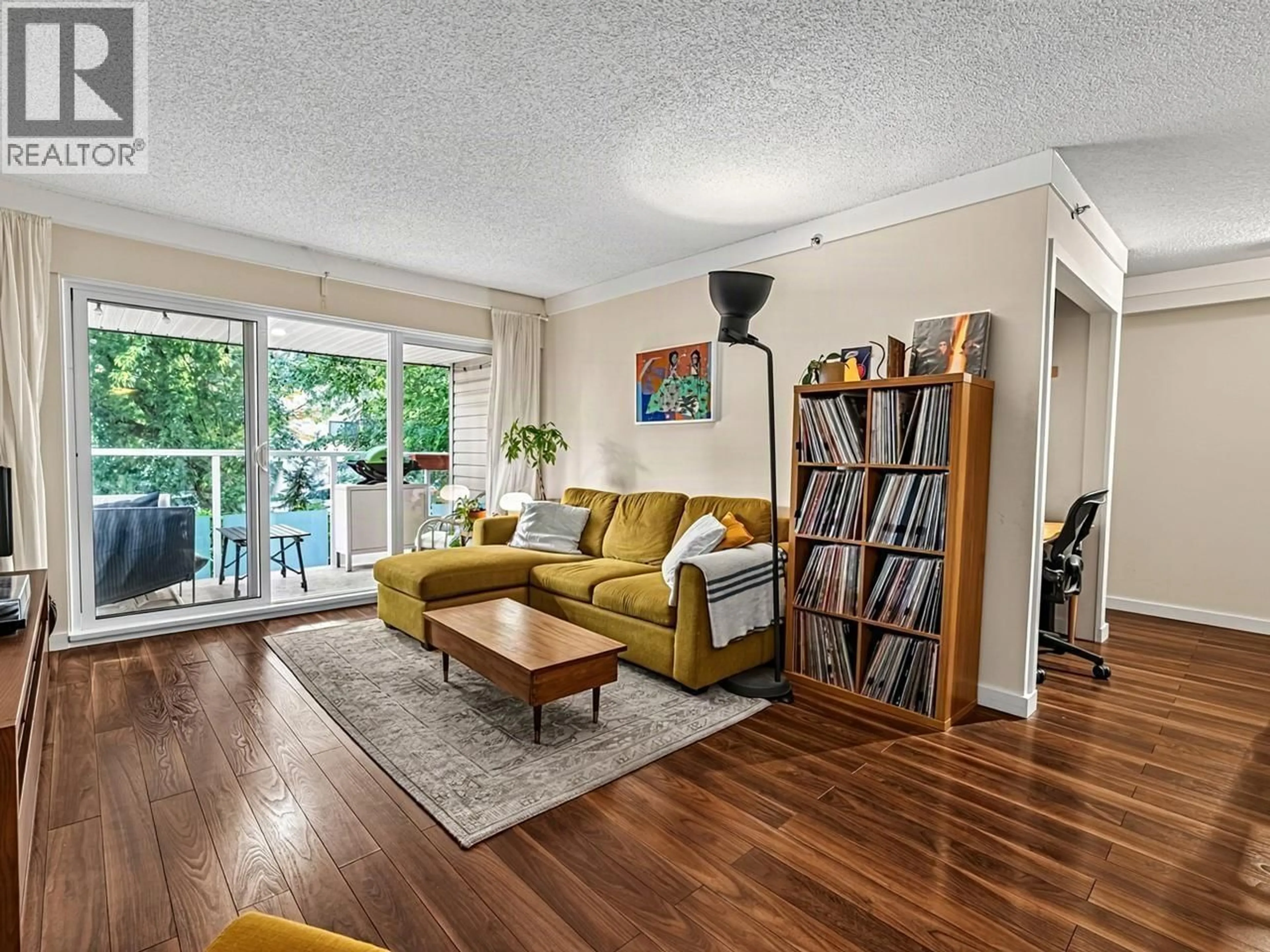 Living room with furniture, wood/laminate floor for 205 - 825 7TH AVENUE, Vancouver British Columbia V5T1P4
