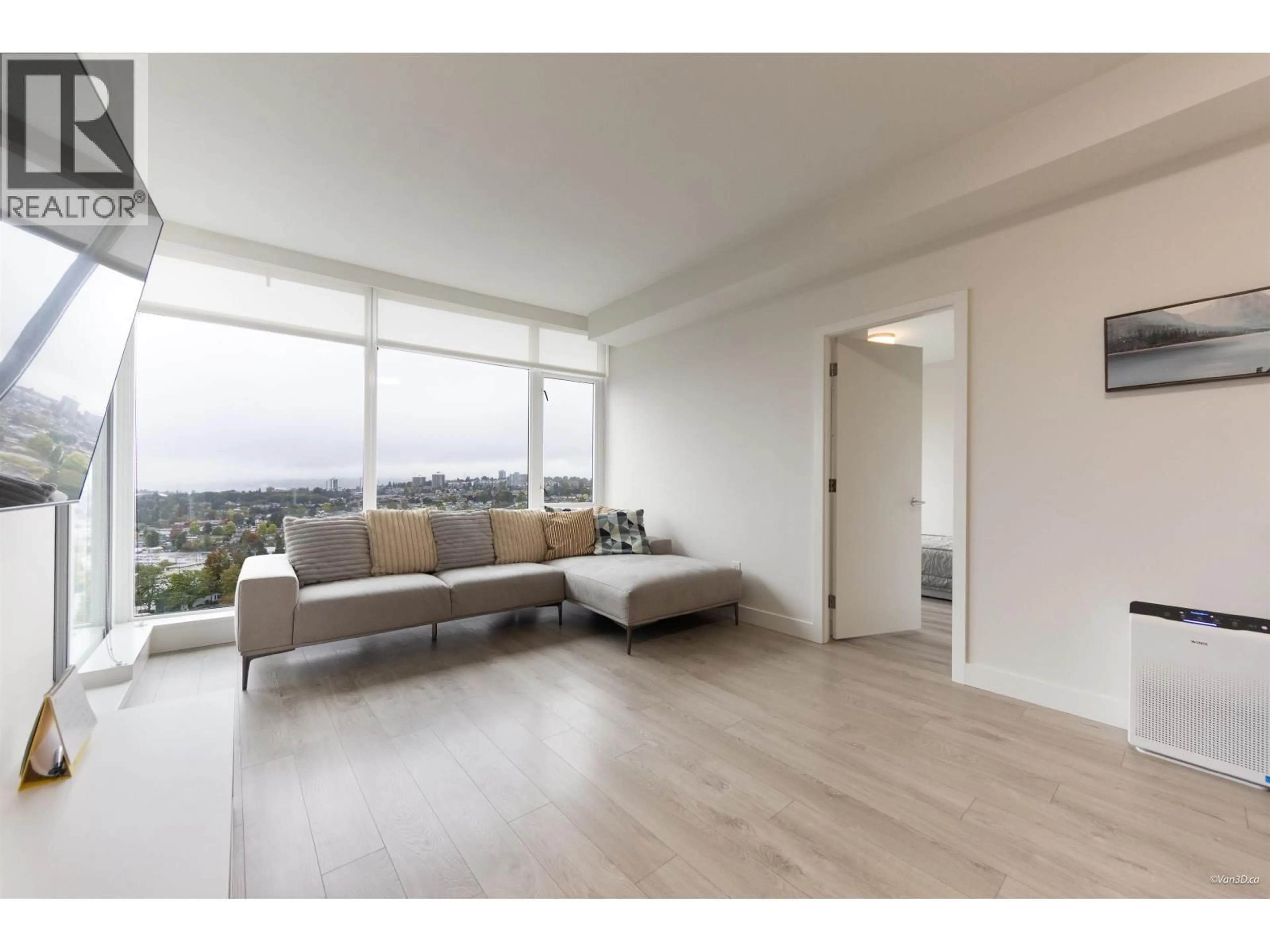 Living room with furniture, wood/laminate floor for 2407 - 1788 GILMORE AVENUE, Burnaby British Columbia V5C0L5