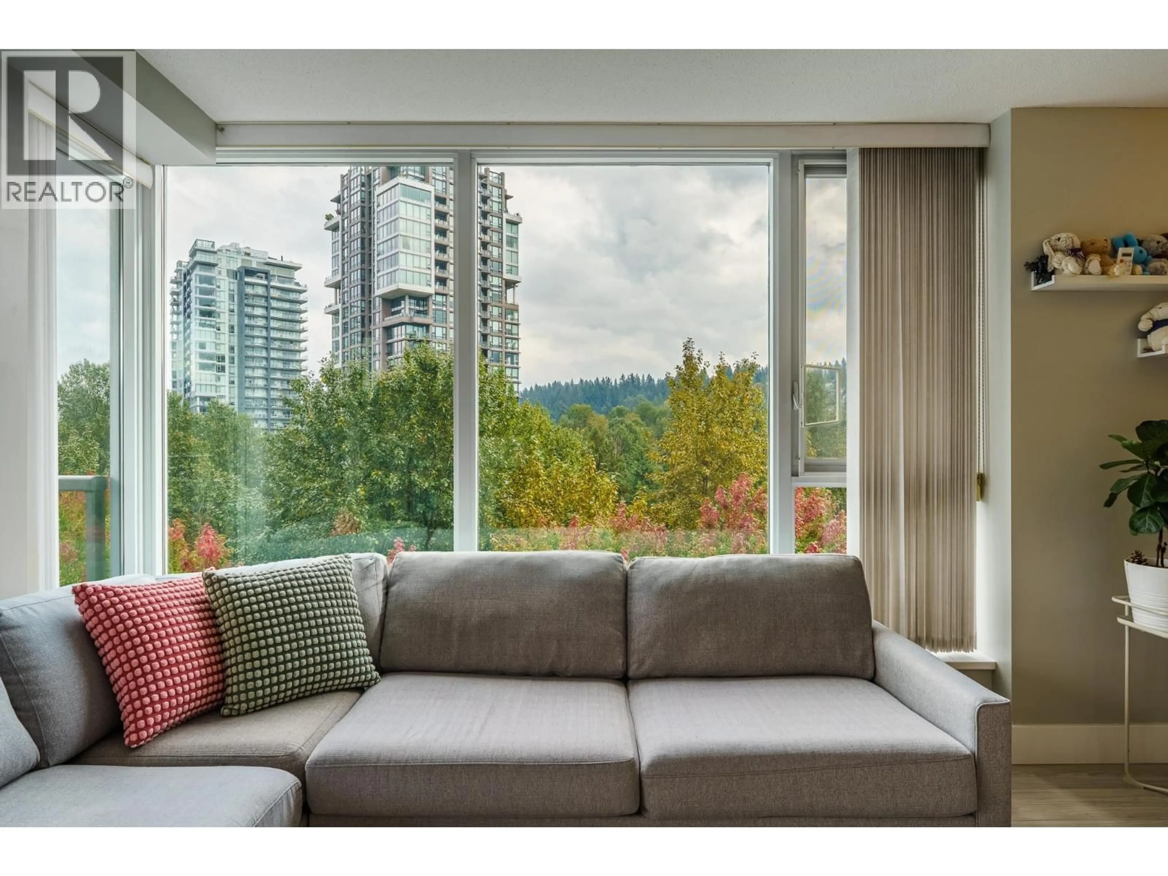 Living room with furniture, wood/laminate floor for 1208 - 660 NOOTKA WAY, Port Moody British Columbia V3H0B7