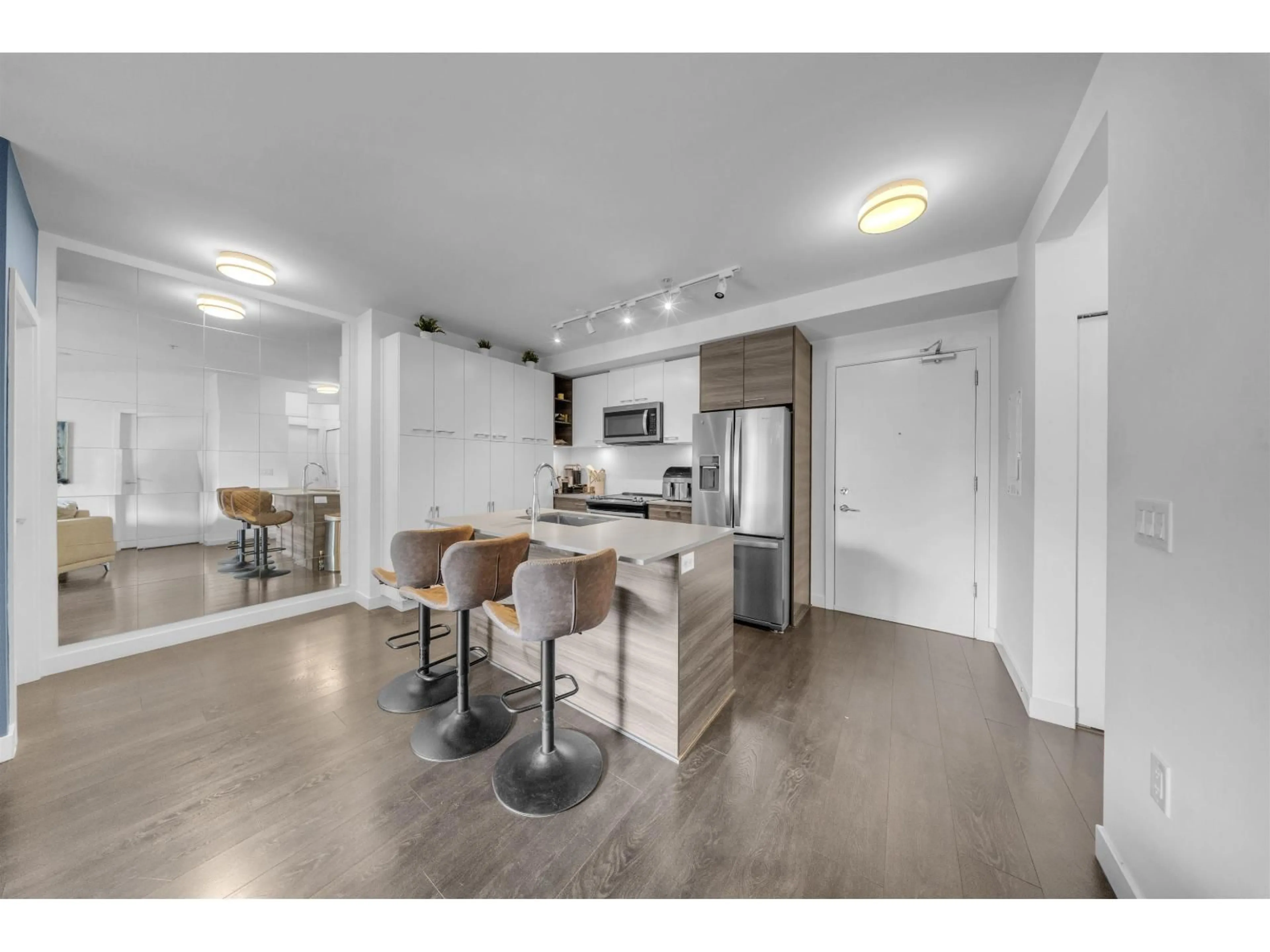 Open concept kitchen, wood/laminate floor for 309 - 10603 140 STREET, Surrey British Columbia V3T0M7
