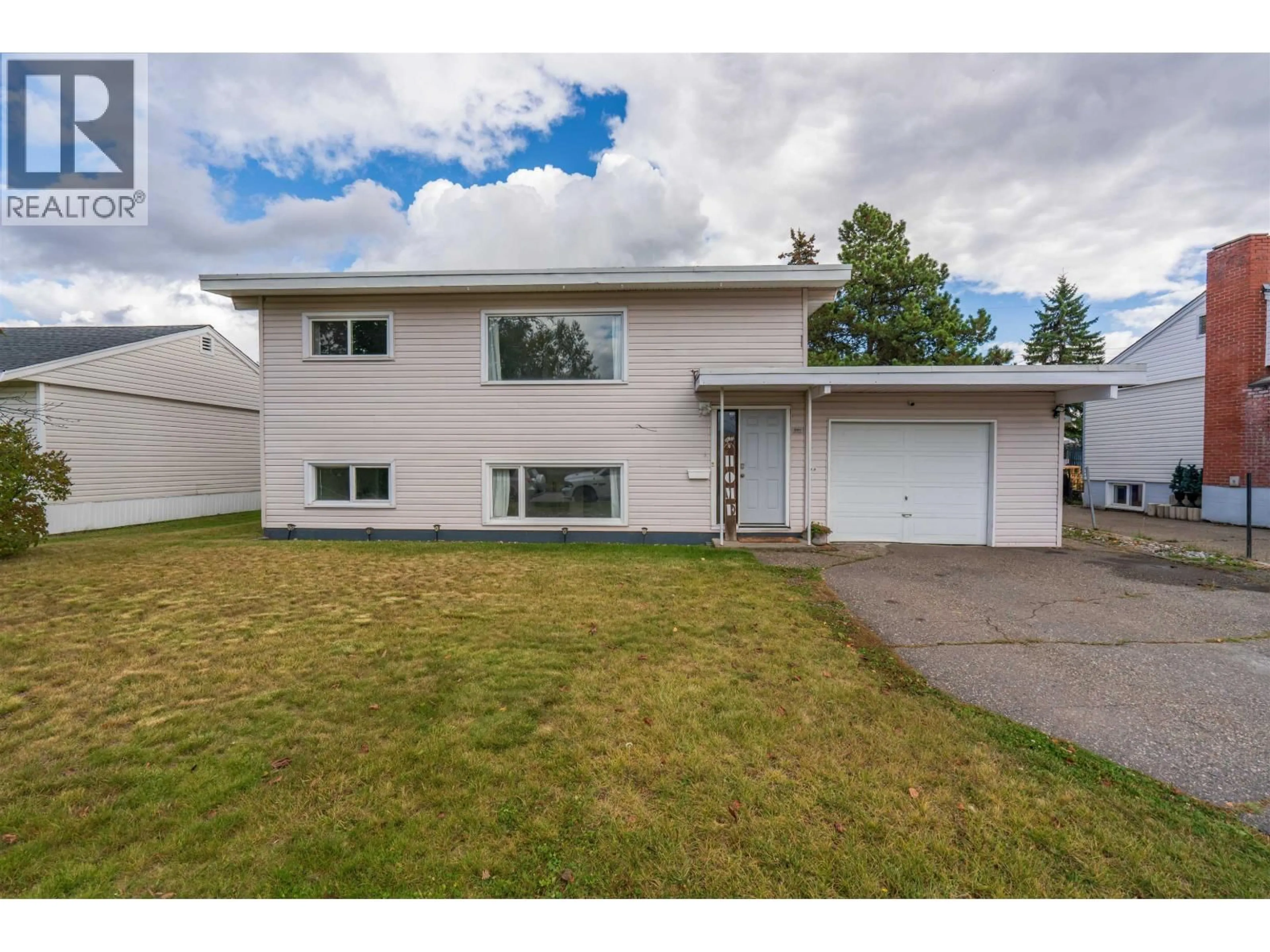Home with vinyl exterior material, street for 894 IRWIN STREET, Prince George British Columbia V2M2X9