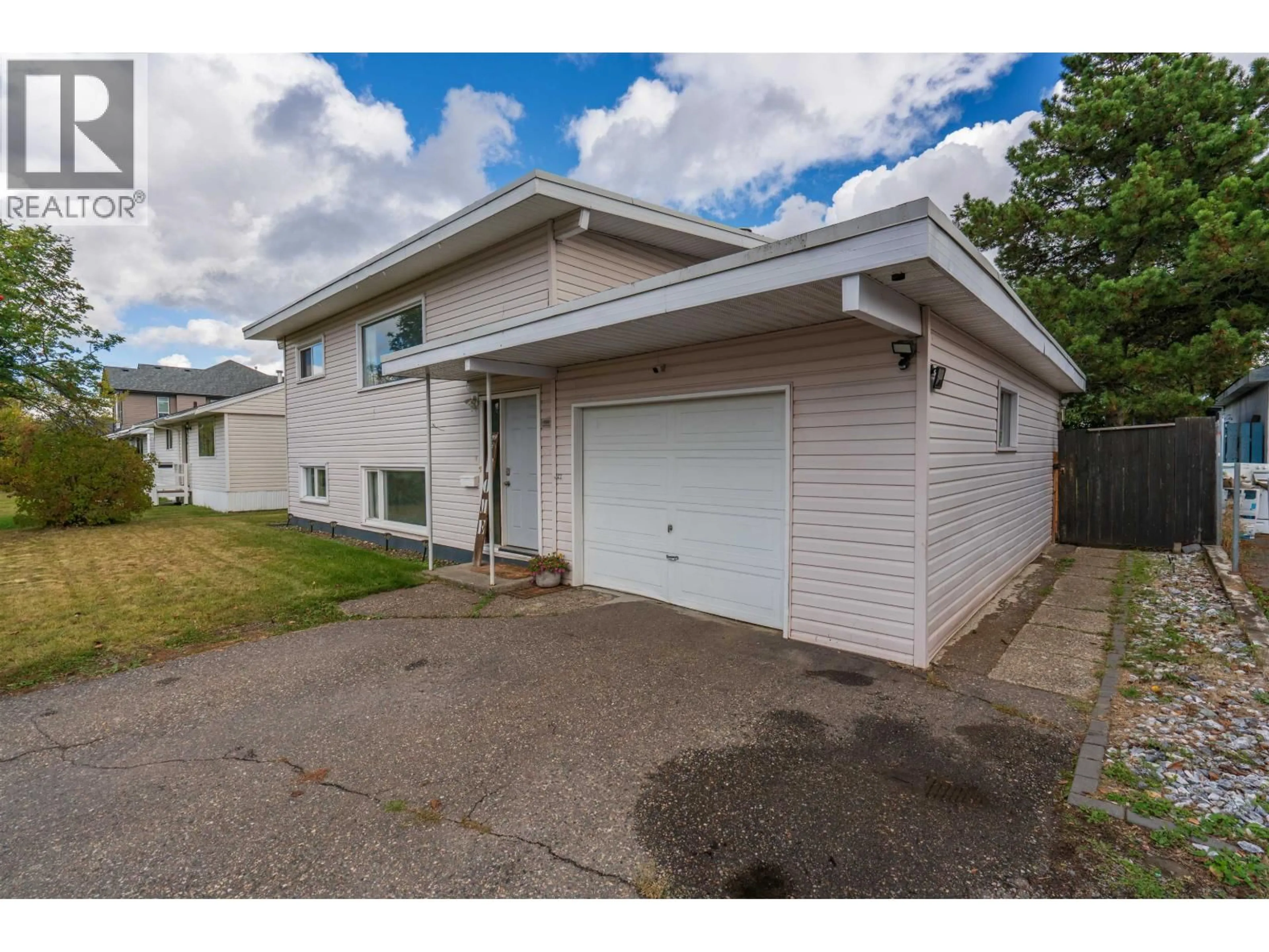 Home with vinyl exterior material, street for 894 IRWIN STREET, Prince George British Columbia V2M2X9