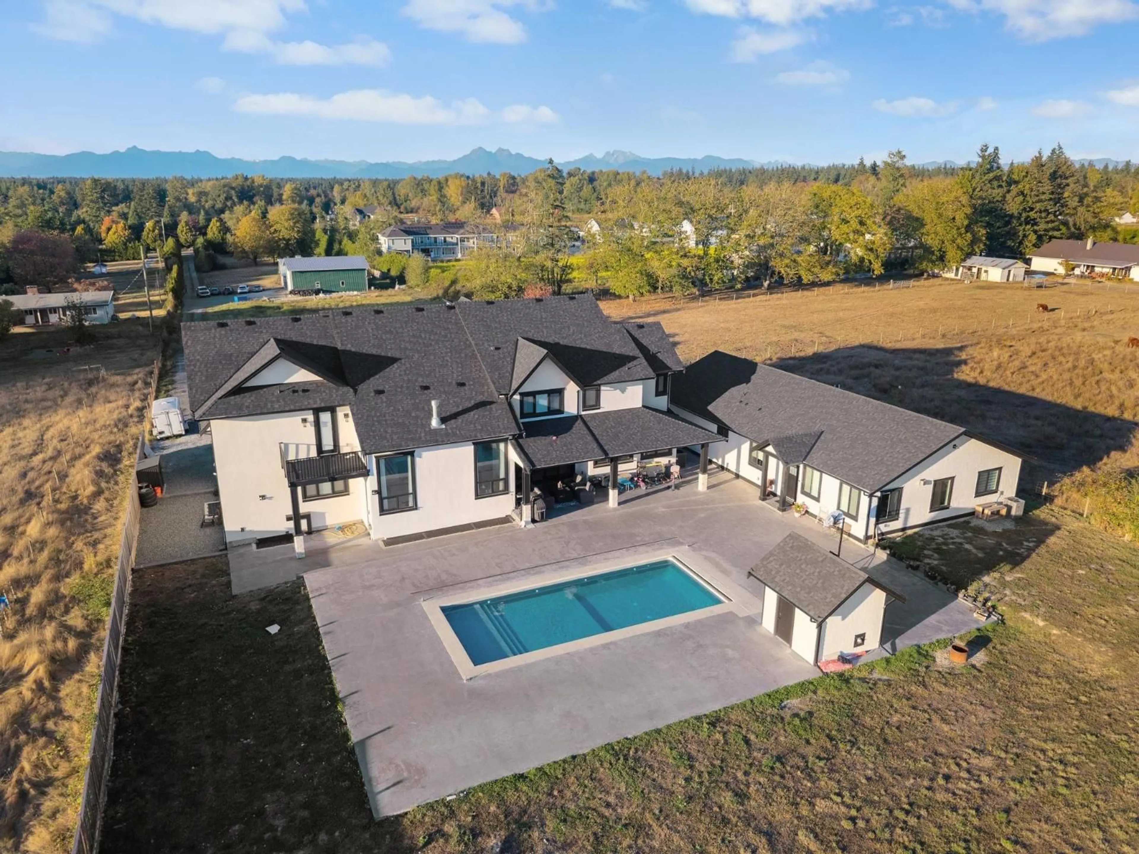 A pic from outside/outdoor area/front of a property/back of a property/a pic from drone, mountain view for 19890 16 AVENUE, Langley British Columbia V2Z1K1