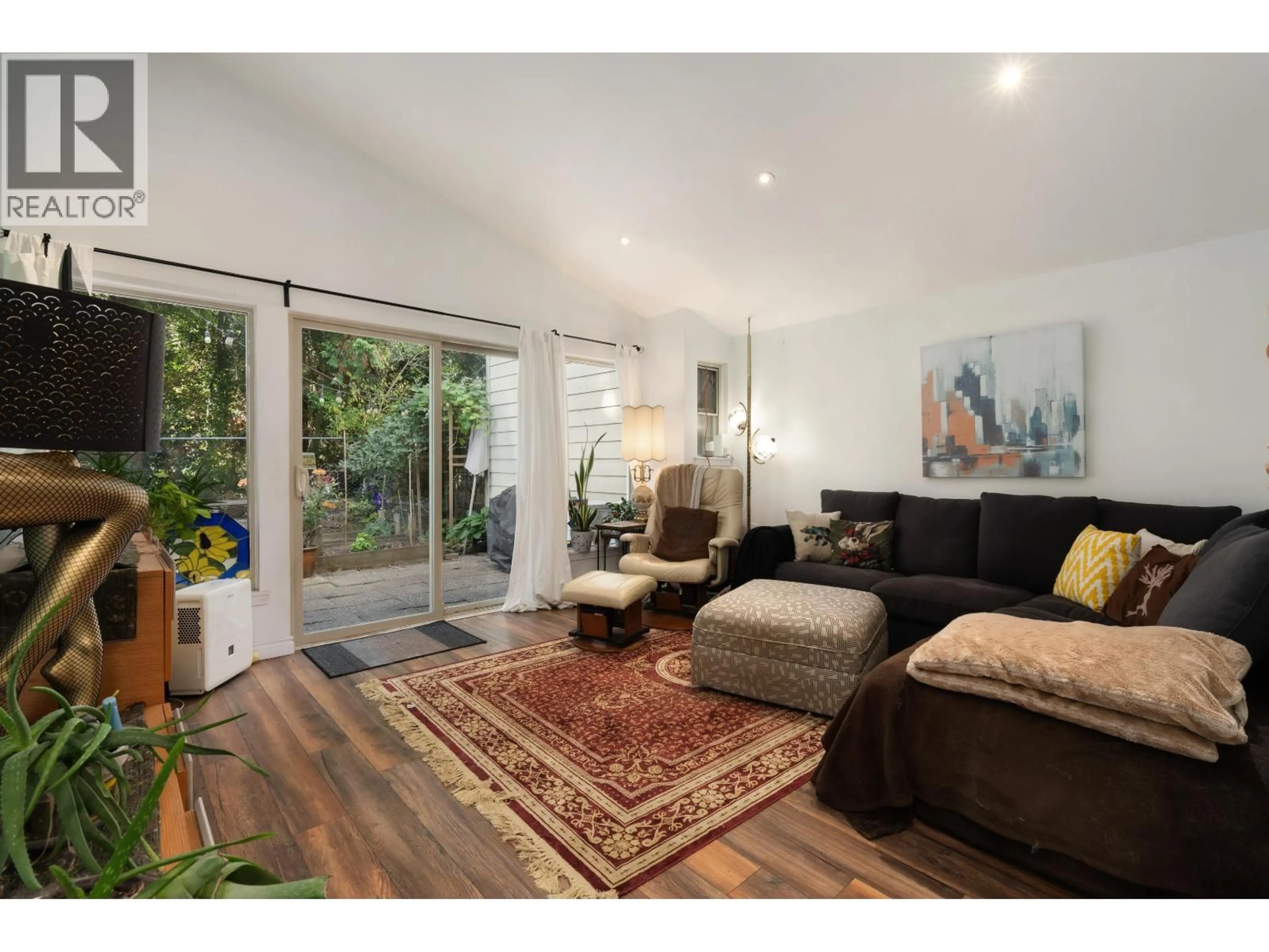 Living room with furniture, wood/laminate floor for 7355 CELISTA DRIVE, Vancouver British Columbia V5S4A1