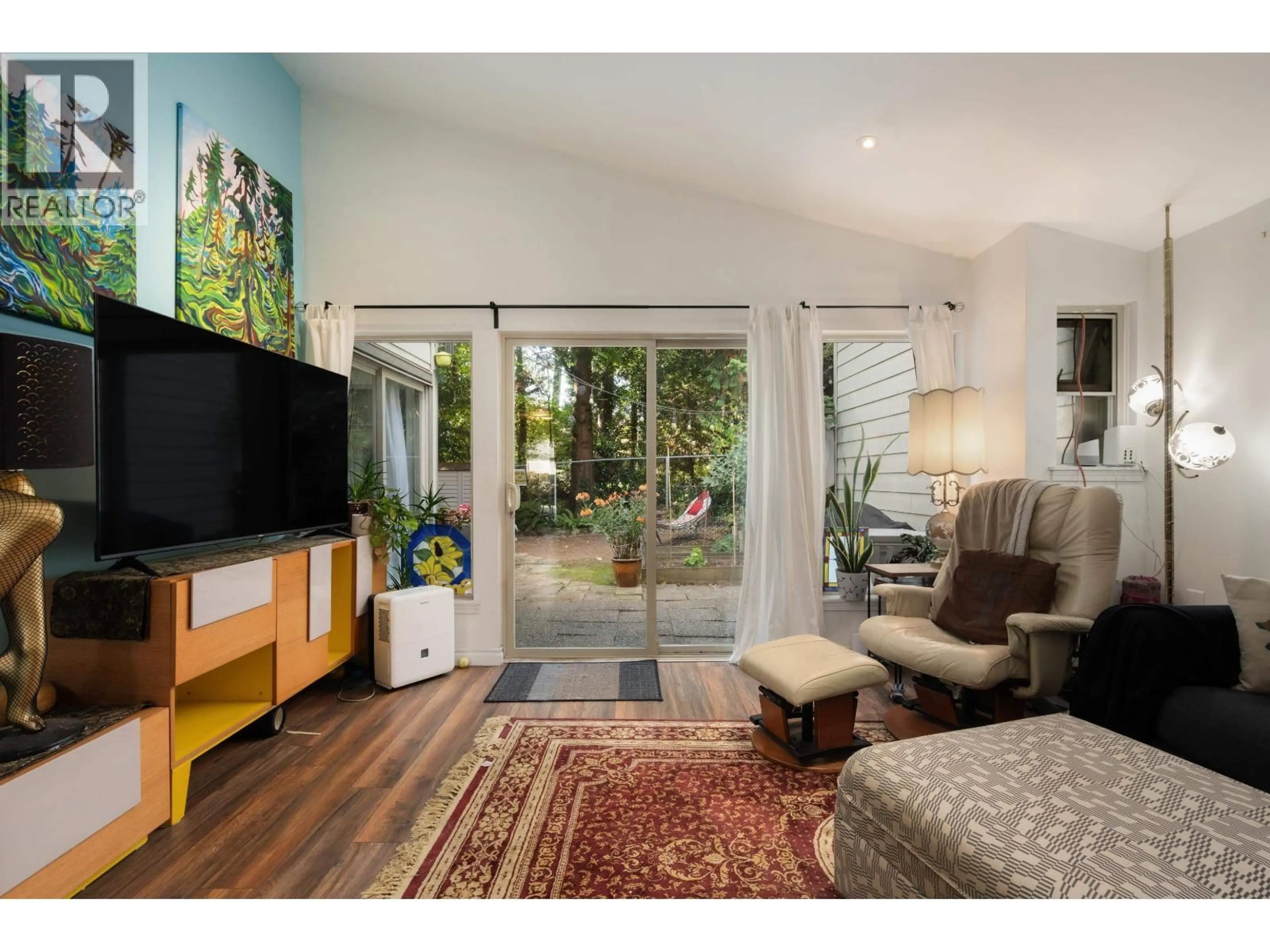 Living room with furniture, wood/laminate floor for 7355 CELISTA DRIVE, Vancouver British Columbia V5S4A1
